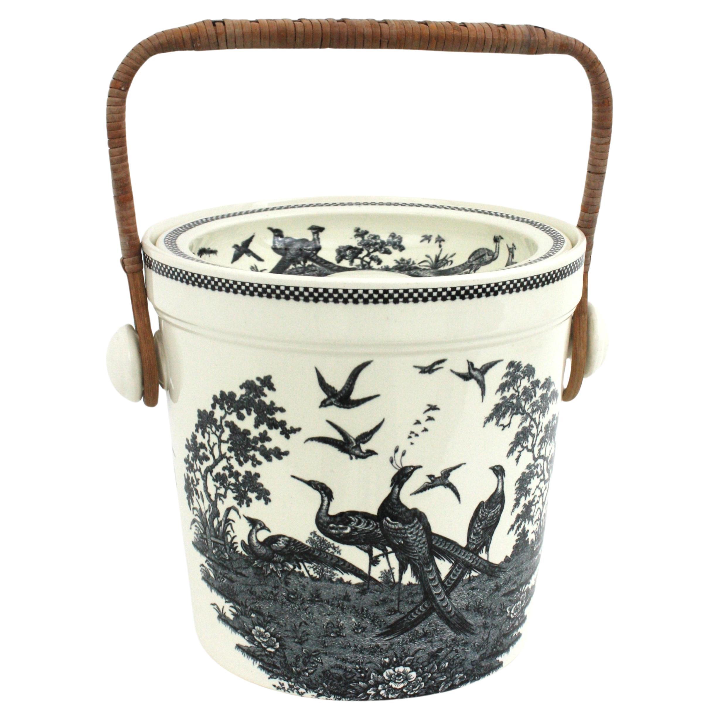 Wedgwood Etruria Porcelain Container Slops Bucket with Cane Handle, England, 1930s.
A Victorian Wedgwood Chinoiserie patterned porcelain slops bucket with an original swinging cane handle and lid. 
Black transferware pheasants landscape