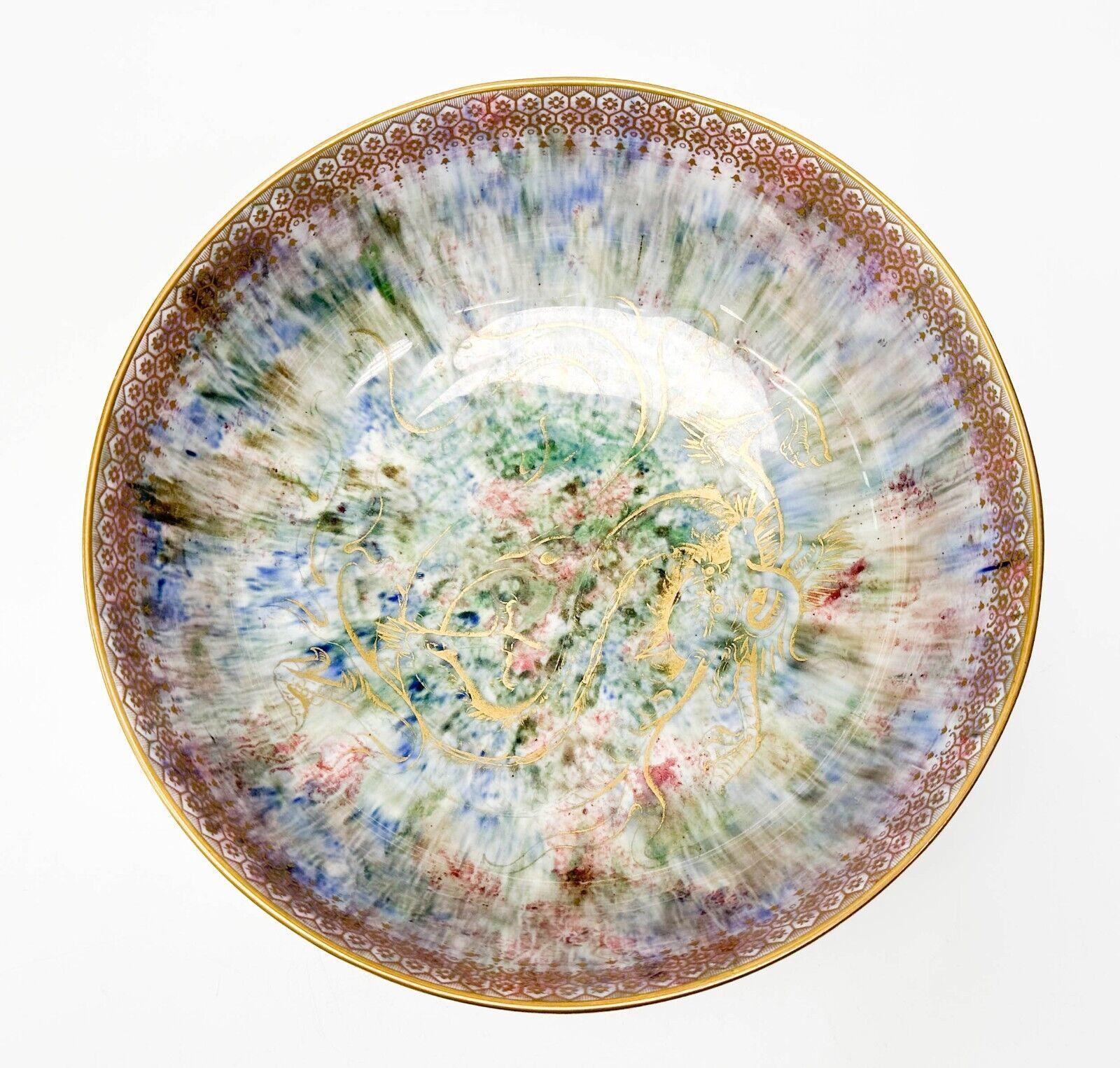  Wedgwood England porcelain bowl. A mottled orange exterior, mottled blue green and red interior. An iridescent finish, decorated with gilt dragons. Underside marked Wedgwood England Z4824

Additional Information:
Material: Porcelain 
Type: