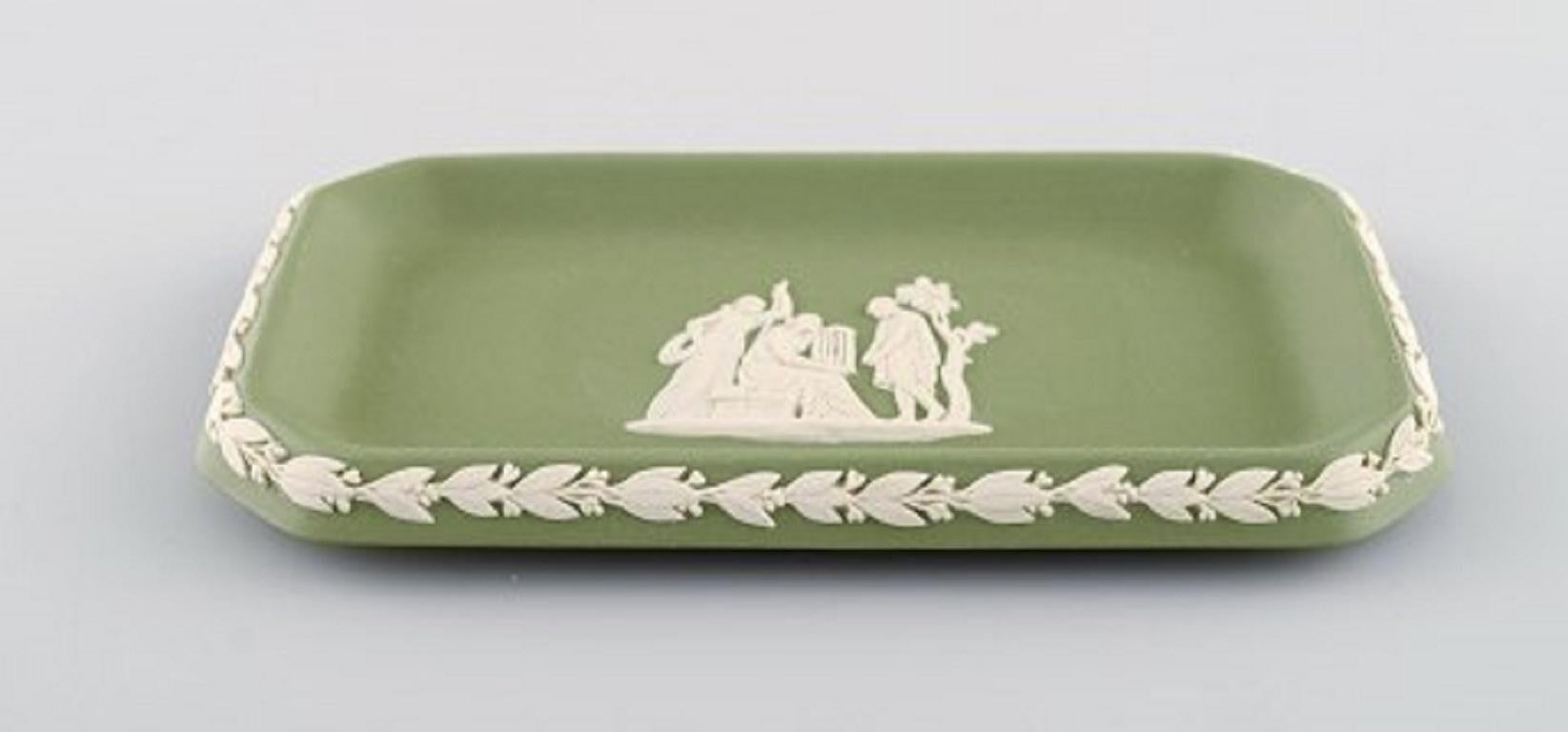 Wedgwood, England. Small dish in green stoneware with classicist scenes in white, circa 1930.
Measures: 16 x 8.5 cm.
Stamped.
In very good condition.