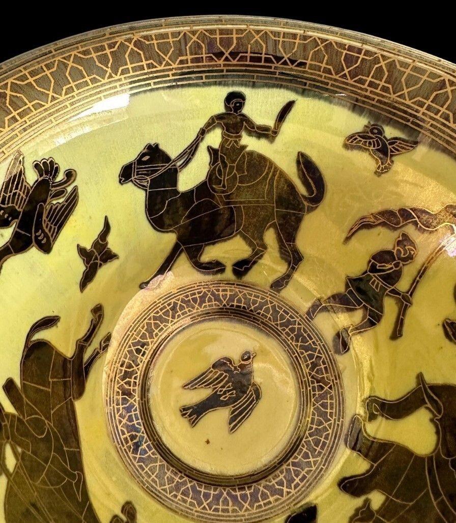 5436
Daisy Makeig Jones for Wedgwood. An “Antique Centre” Fairyland Lustre Bowl decorated int he Lahore design featuring and Elephant, Camel and Horse being ridden by Warriors with a highly lustrous Art Deco exterior
14cm high, 22.5cm wide
Circa 1920