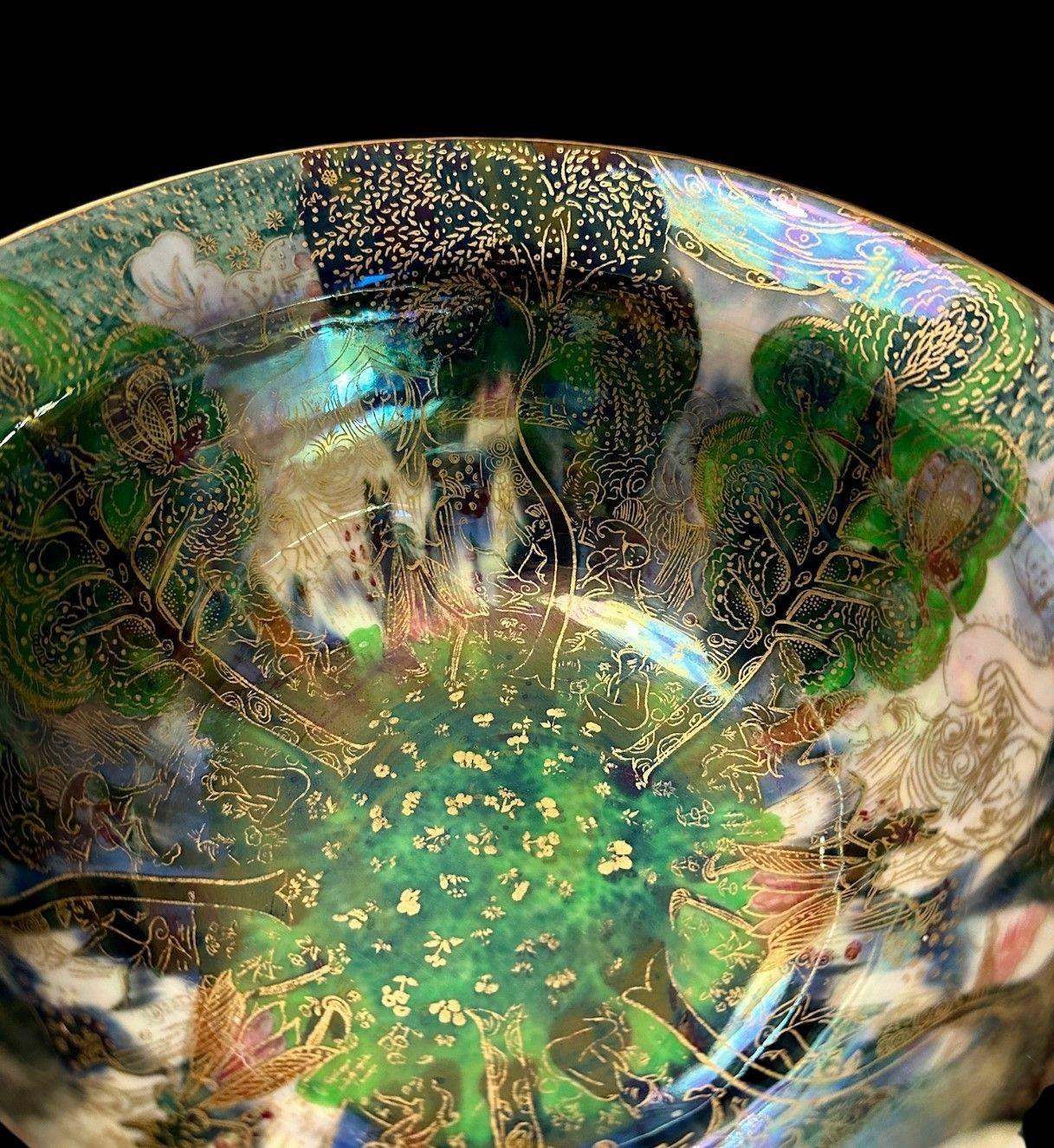 5473
Wedgwood Fairyland Lustre K’ang Hsi Bowl in the “Woodland Bridge” and “Garden of Paradise” Designs
9cm high, 18.5cm wide
Circa 1915