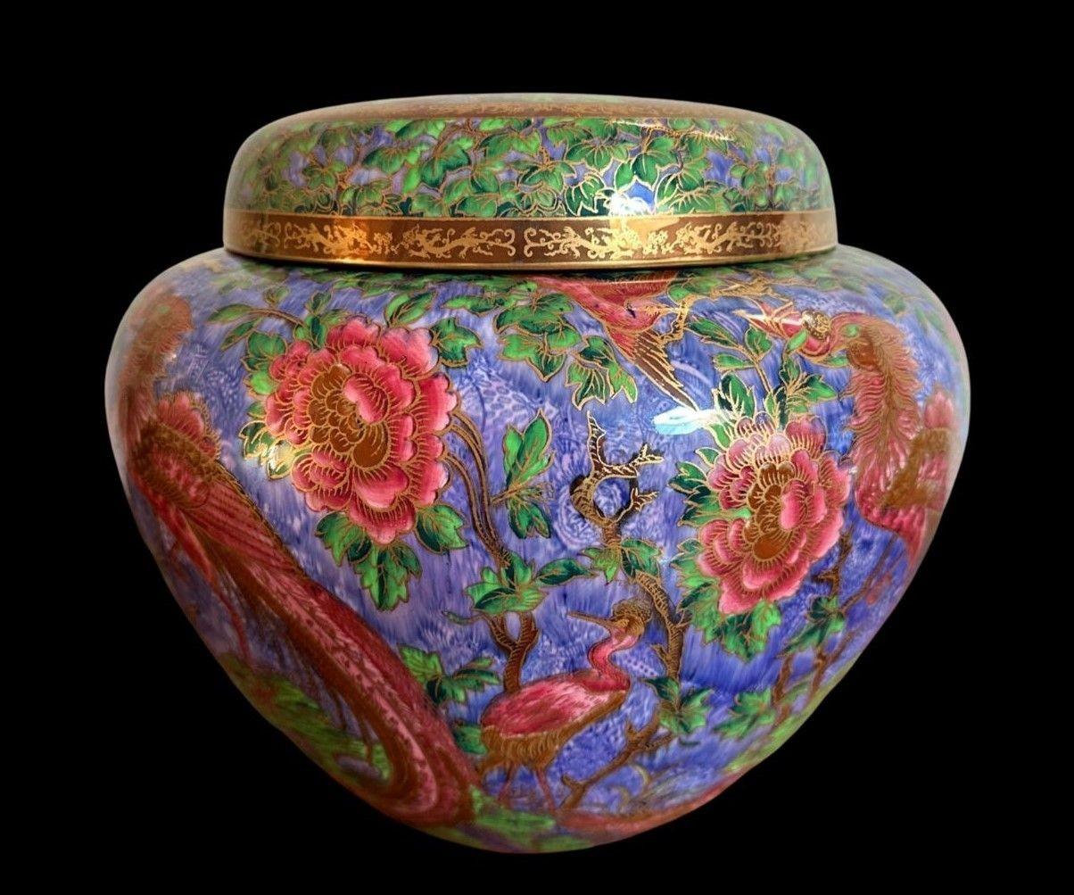 170
Very Large and Rare Wedgwood Fairyland Lustre Ginger Jar decorated in the “Argus Pheasant / Phoenix” Design. Designed by Daisy Makeig Jones.
This shape and design combination are unrecorded in “Wedgwood Fairyland Lustre” by Una des Fonatines