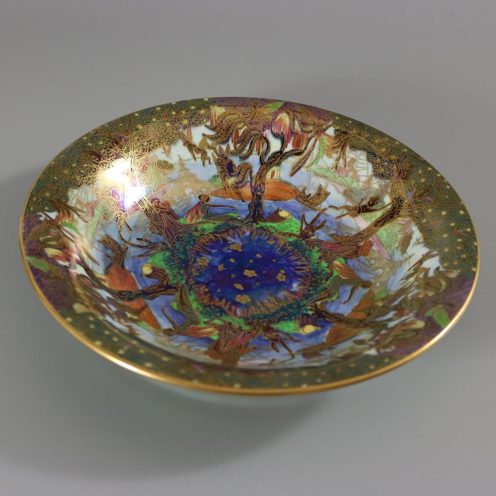 Wedgwood Fairyland Lustre Lily Tray, shape number 2483. Decorated with 'Jumping Faun' pattern to interior, 'Flight of Birds' to exterior. 'Pebble and Grass' border to exterior rim and foot rim. The 'Jumping Faun' pattern features a river scene,