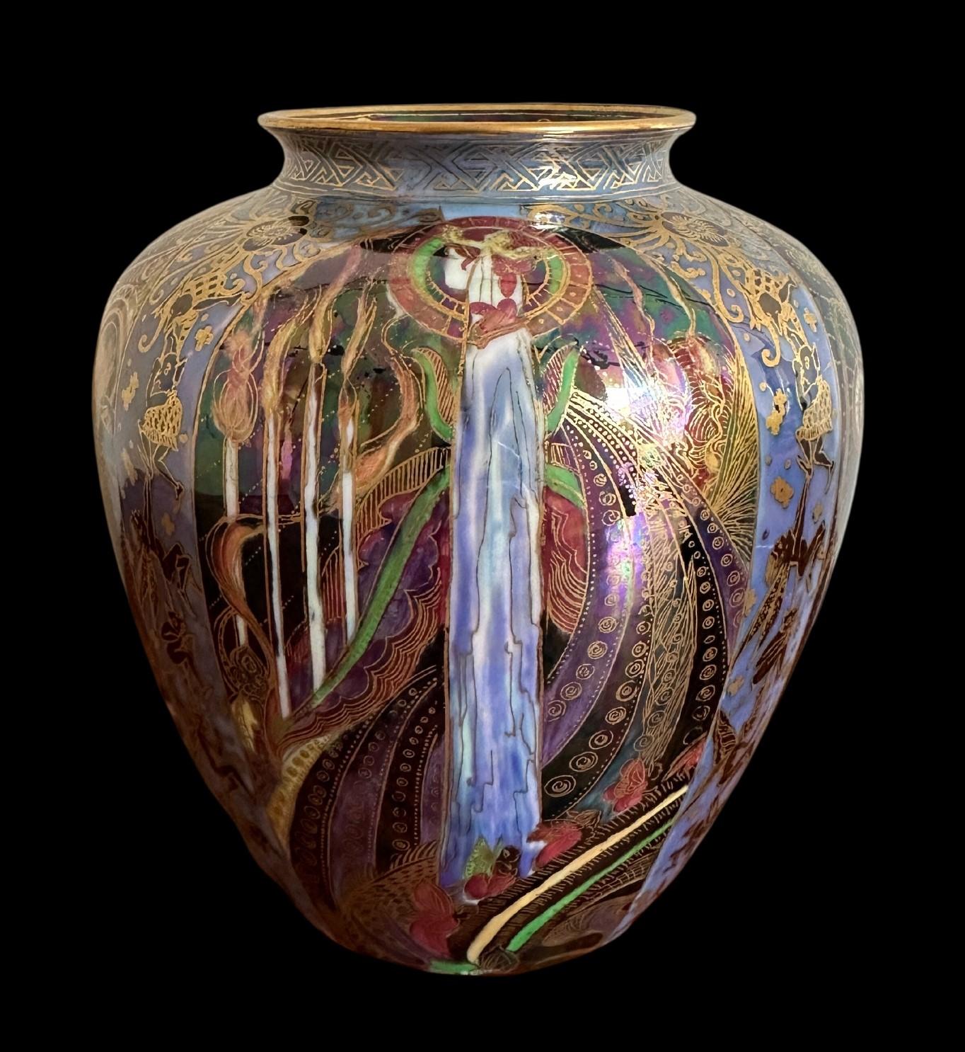 5392
Wedgwood Fairyland Lustre Porcelain Vase decorated in the “Candlemas” design by Daisy Makeig Jones
19cm high, 16cm wide
Circa 1920.