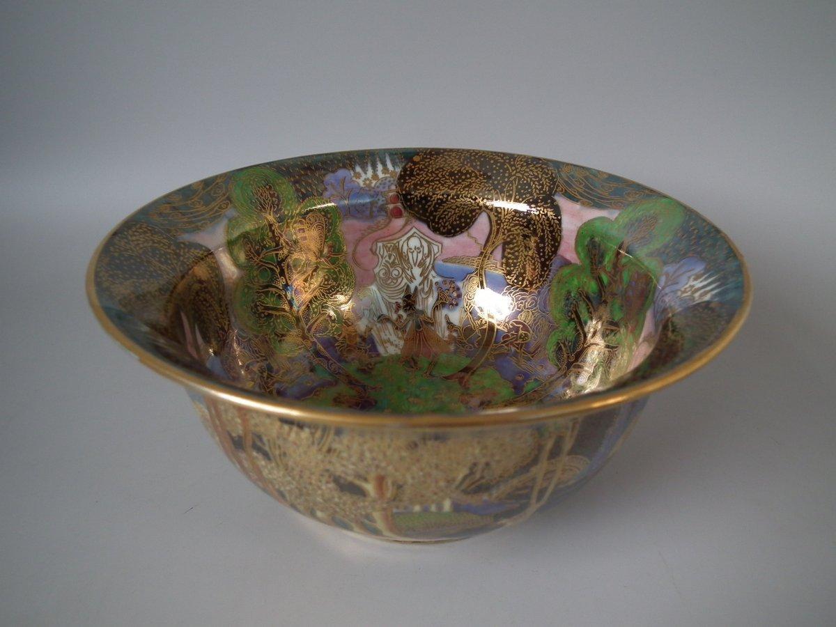 Wedgwood Fairyland lustre K'ang Hsi bowl. The exterior decorated in the 'Woodland Bridge Variation 1' design on black ground. The interior with a variation of the 'Garden in Paradise' design. Cobble bead border to the foot rim. Portland vase’ back