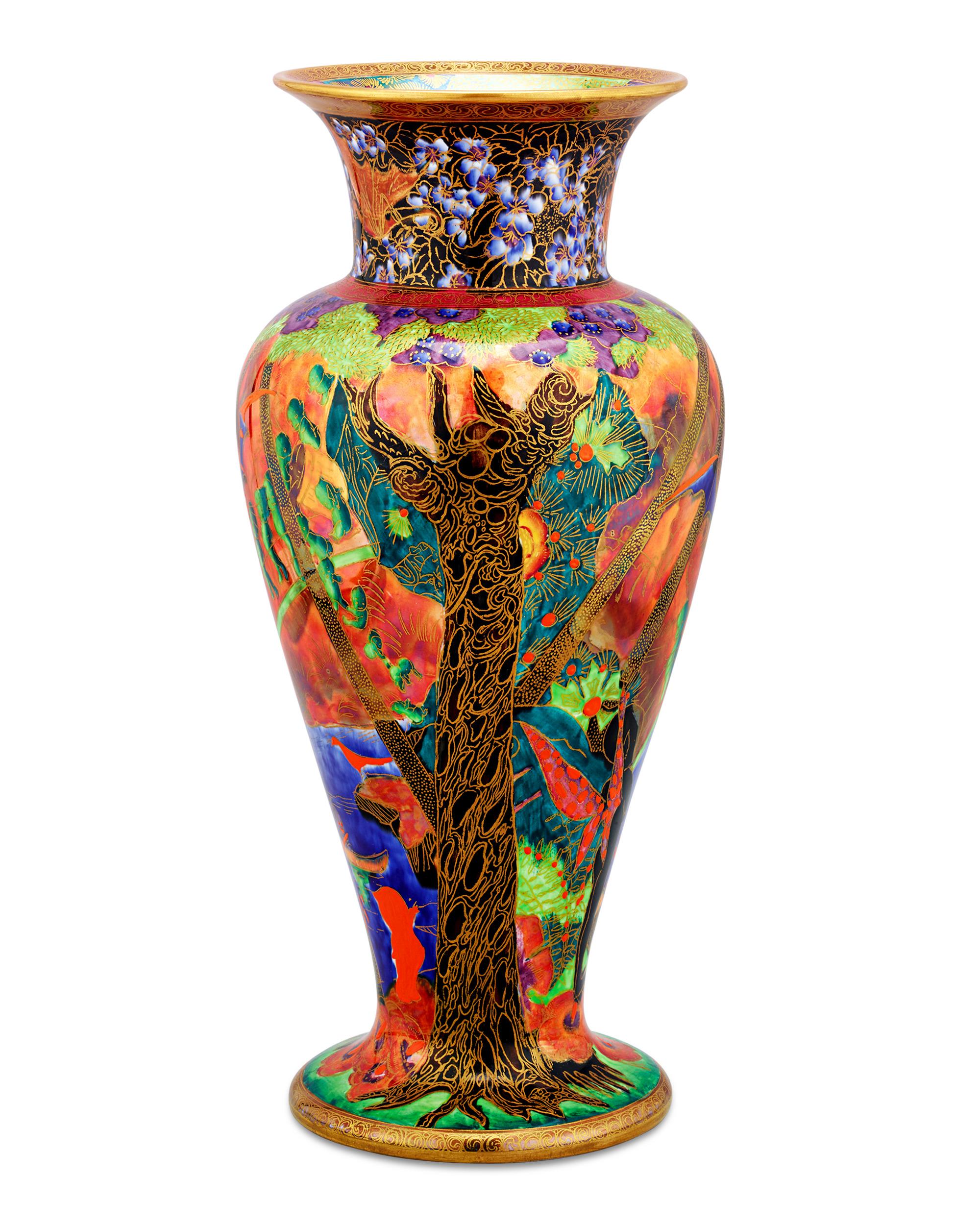 This rare Flame Fairyland Lustre vase by Wedgwood features the fantastic Imps on a Bridge and Treehouse design, one of the most popular created in the enchanting collection. The imaginative motif depicts a bat-like Roc bird gliding above a line of