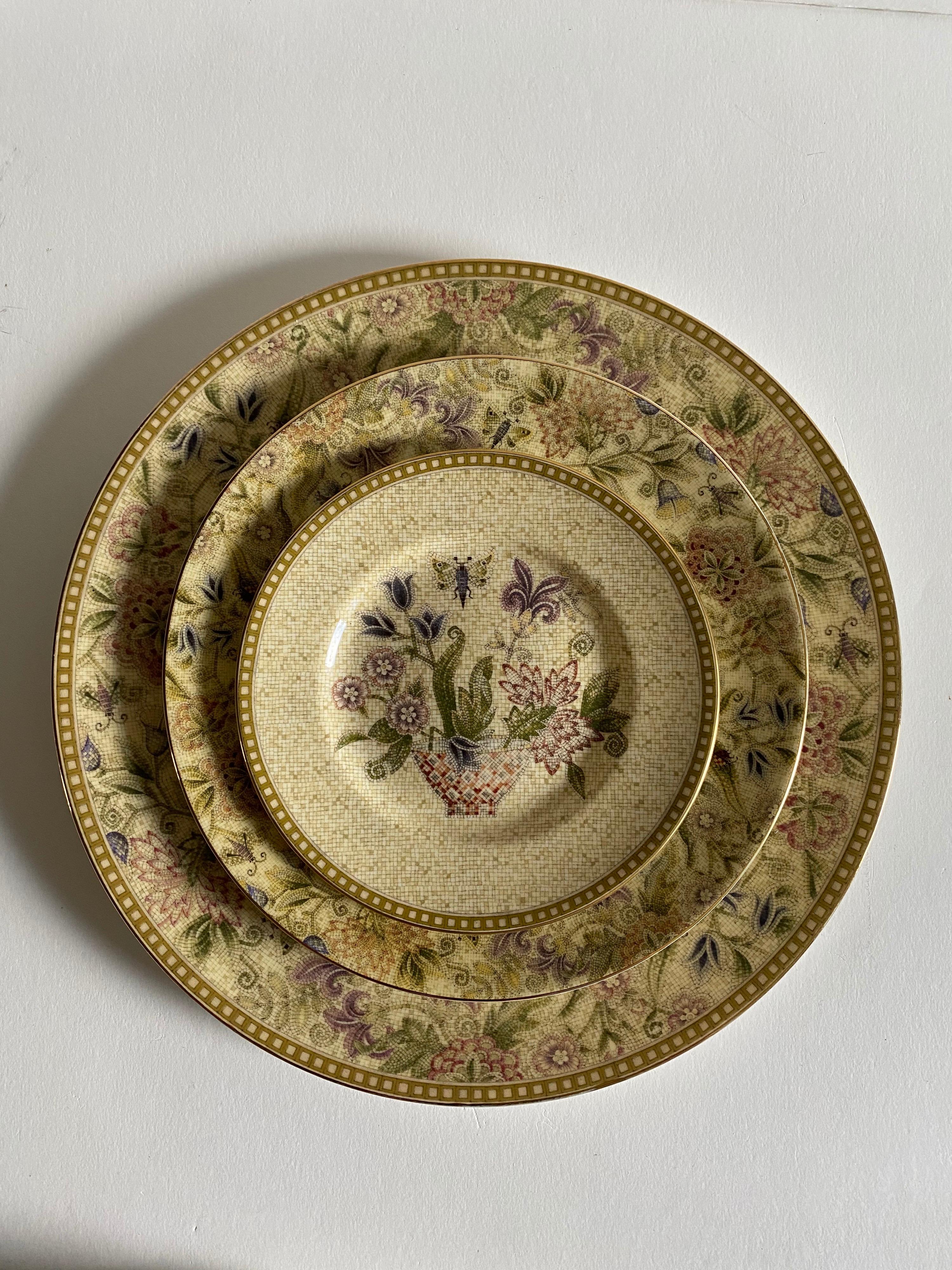 An 25 piece lot of dinnerware in the Floral Tapestry pattern by Wedgwood. 

Signed. Made in England. Produced from 1997 to 2005.

Bone china.

Includes the following 25 pieces:
10 pcs- Dinner plates, width: 10-3/4 inches.
10 pcs- Bread plates,
