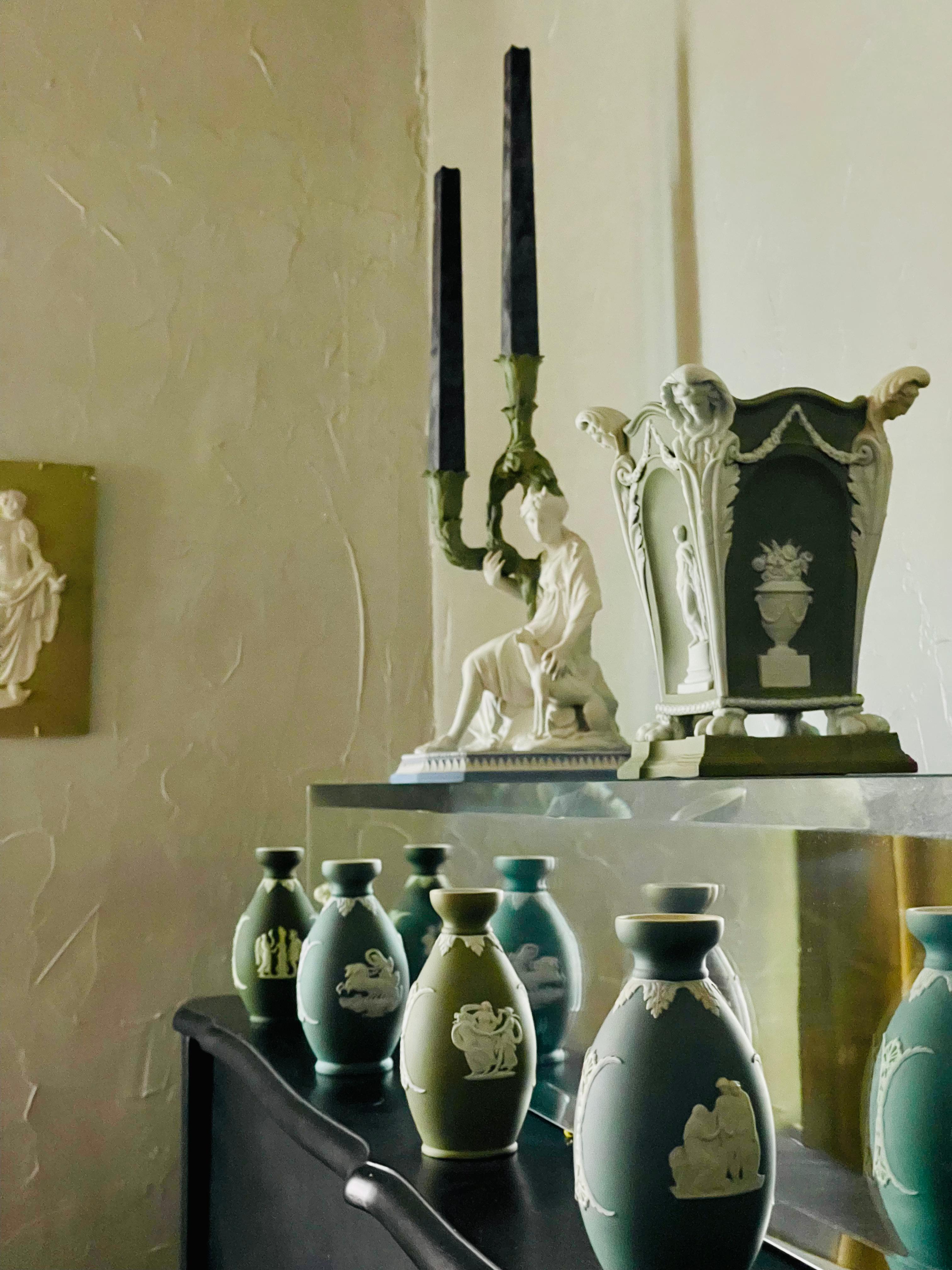 Etruria, Staffordshire, c.1790, white jasper pierced grid, molded green body ornamented with bas-relief figure of Venus and alternating urns of flowers within molded arches, high-relief floral festoons, corners as caryatids and foliage supports on