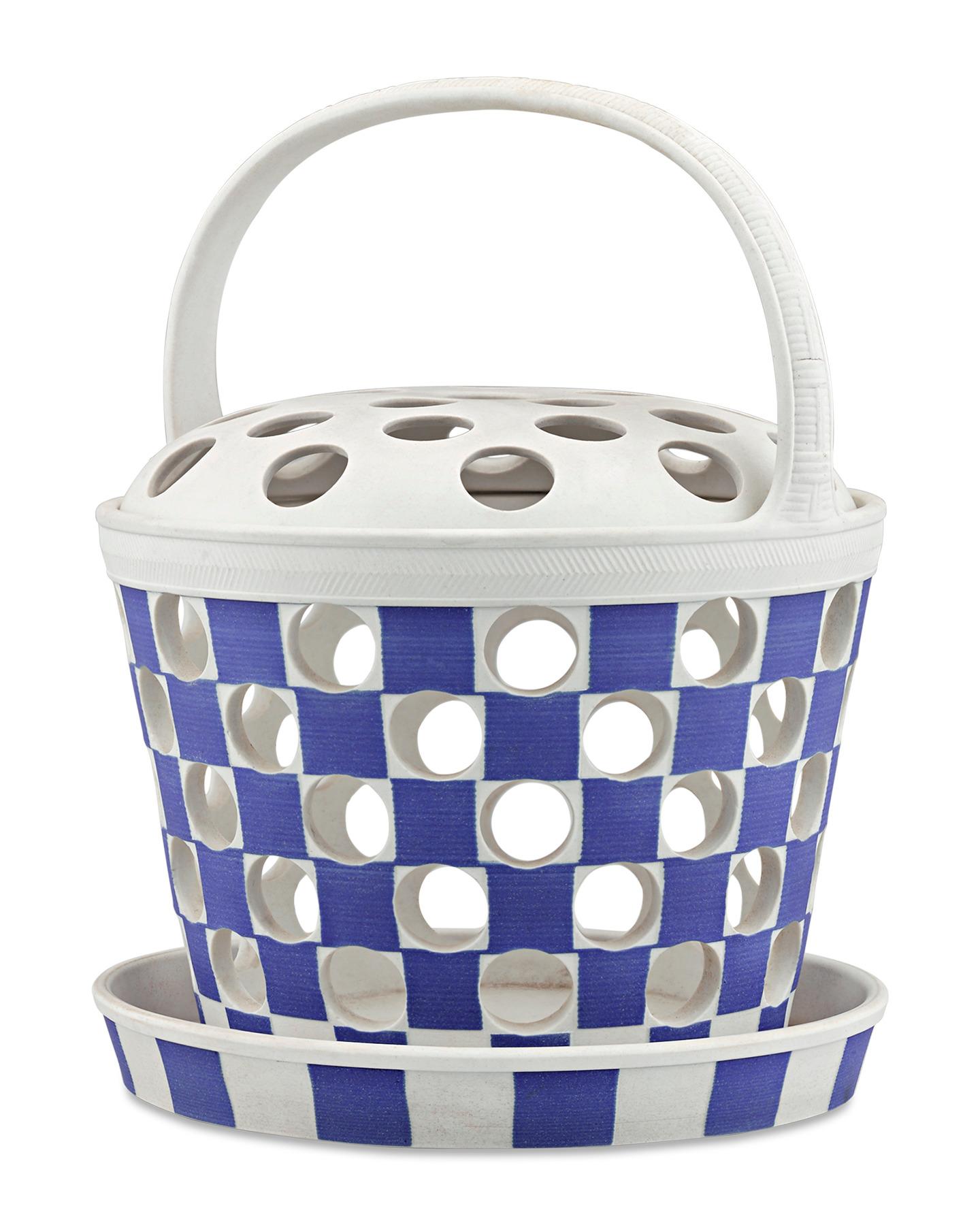 One of Wedgwood’s most acclaimed “useful wares,” this fine jasper-dip pierced orange basket displays a brilliant cobalt blue and white checkerboard pattern in the firm’s classic “biscuit” finish. The bowl and lid’s striking “pierced” latticework