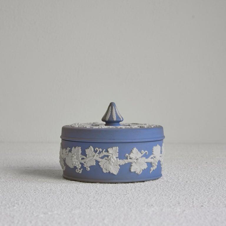 Wedgwood Jasperware Lidded box, England, 20th century.    This is a quintessential piece of Wedgwood Jasperware. Lidded box in the famous Jasperware blue and white decor. Neo-classical and elegant. Please note the beautiful white decoration with