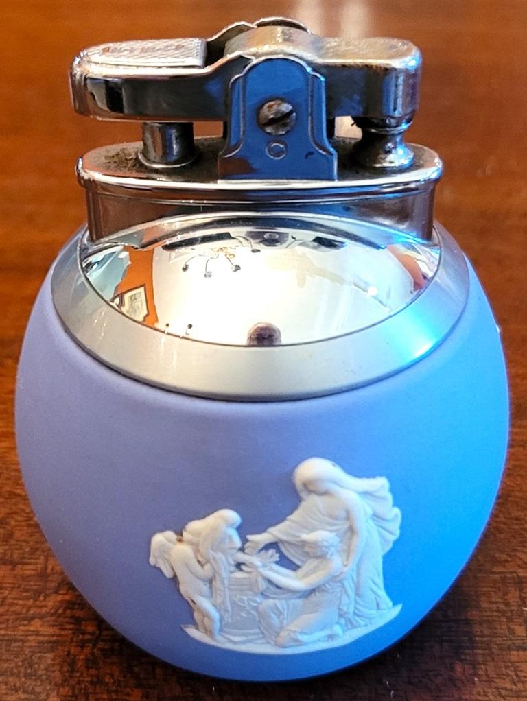 PRESENTING A LOVELY Wedgwood Jasperware Pale Blue Art Deco Ronson Desk Lighter.

Made by Wedgwood in England circa 1920-29, in collaboration with the world famous Ronson company and fully and properly marked/stamped on base.

Simply and clearly
