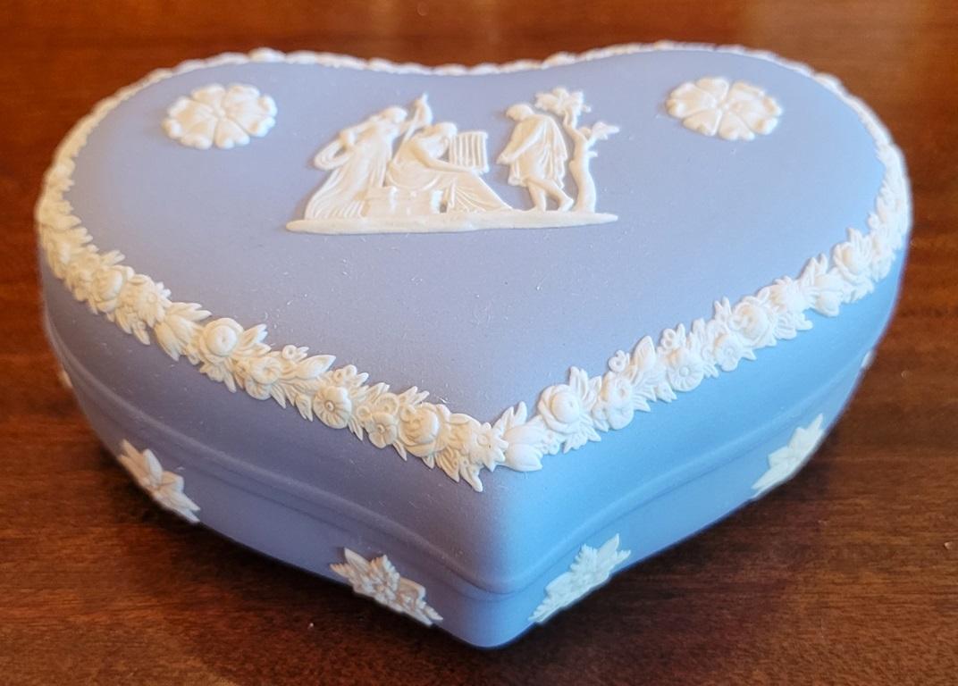 PRESENTING A LOVELY Wedgwood Jasperware Pale Blue Lidded Heart Trinket Box.

Made by Wedgwood in England circa 1960 and fully and properly marked/stamped on base.

Marked: “Wedgwood, Made in England …. “CG”.

Heart shaped lidded box with