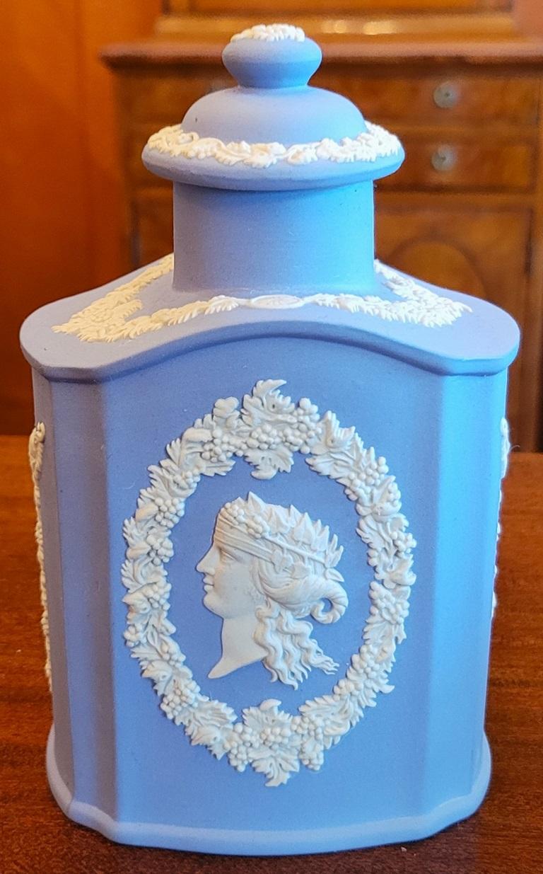 PRESENTING A GORGEOUS Wedgwood Jasperware Pale Blue Lidded Tea Caddy.

Made by Wedgwood in England circa 1950-60 and fully and properly marked/stamped on base.

Marked: “Wedgwood, Made in England …. “R”.

6 inches tall lidded caddy with neoclassical