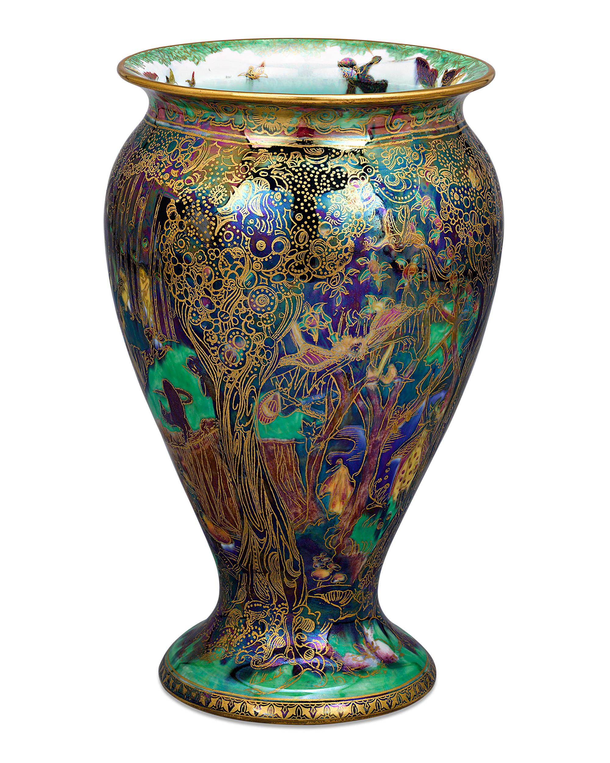 This magnificent Fairyland Lustre vase in the jewelled tree pattern boasts the deep blue, violet and emerald hues for which this motif is revered. Created during the early 20th century, the enchanting Fairyland designs created by Daisy Makeig-Jones