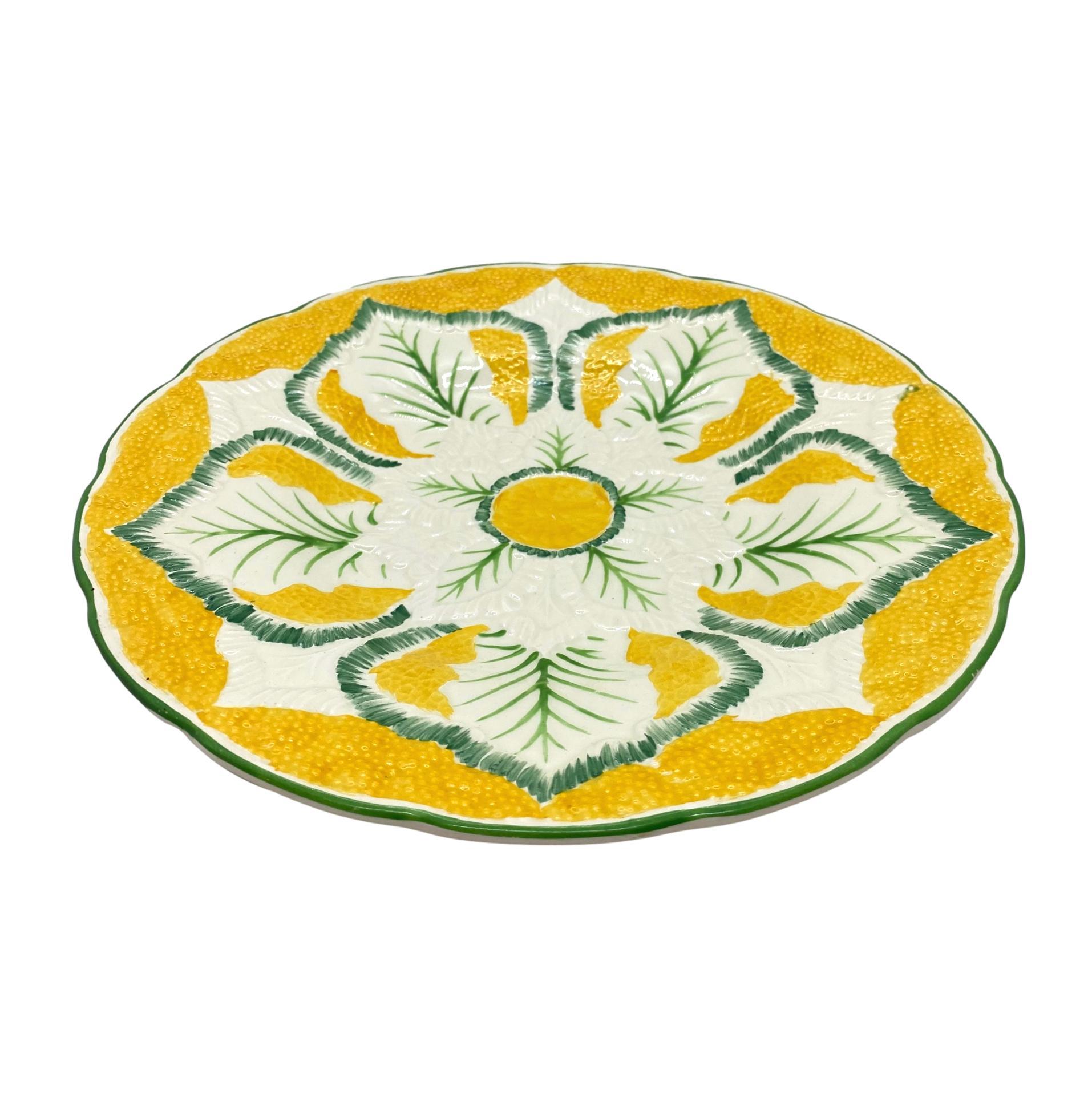 Wedgwood Majolica cauliflower pattern 9-in plate, molded as a stylized blooming cauliflower, on a vividly glazed yellow ground, the reverse with impressed marks: 'Wedgwood' and the firm's date code for November 1923,
English.
For nearly 30 years