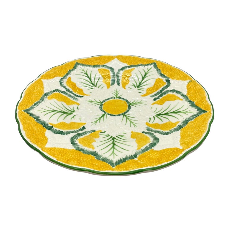 Wedgwood Majolica cauliflower pattern 9-in plate, molded as a stylized blooming cauliflower, on a vividly glazed yellow ground, the reverse with impressed marks: 'Wedgwood' and the firm's date code for November 1923,
English.
For nearly 30 years