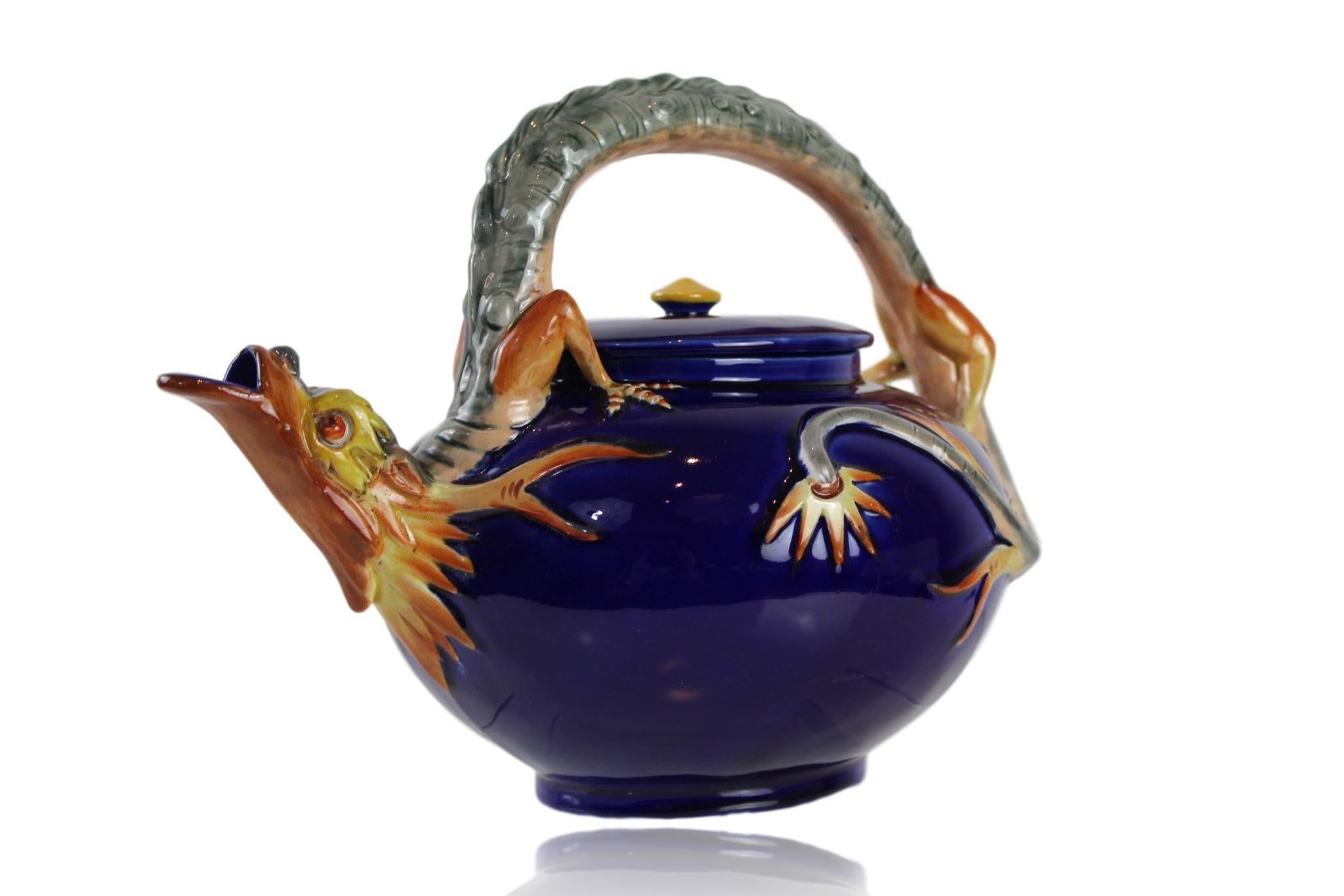 Large Wedgwood Majolica Dragon teapot in cobalt blue, English, Dated 1871, modeled by the famous mid-19th century French sculptor, Hugues Protât. In the Japonisme taste; the bail handle modeled as a dragon, its tail curled around the ovid-shaped pot