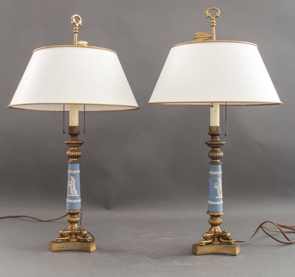 Pair of Wedgwood-mounted Restauration style gilt metal bouillotte lamps, with garlanded blue jasper supports and parchment shades.

Dimensions: 26