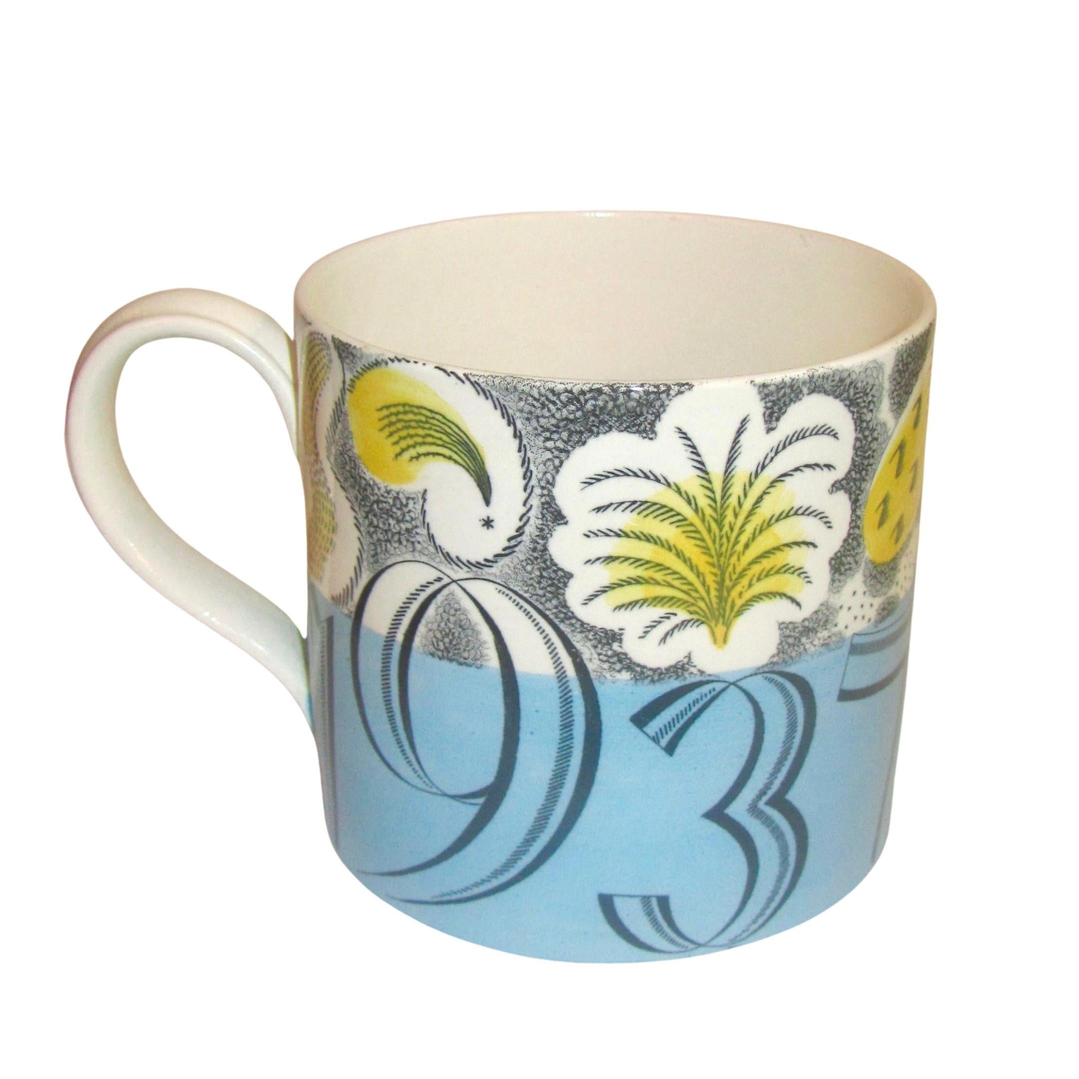 A Wedgwood mug commemorating the coronation of King George VI and Queen Elizabeth, 1937, designed by Eric Ravilious, decorated with fireworks above a dated blue band, impressed, black printed and painted marks to base
Measures: Height 10 cm