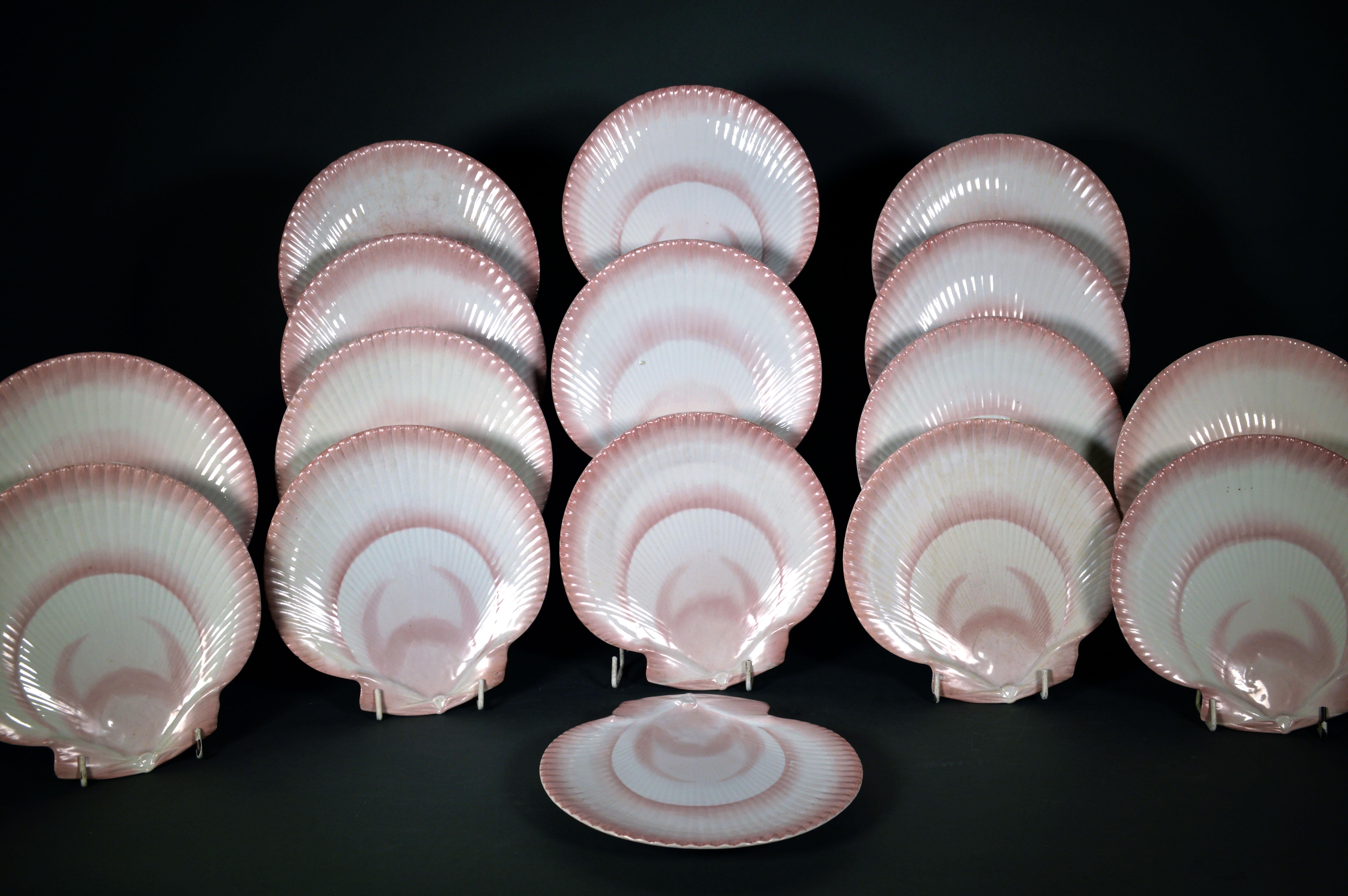 Wedgwood Nautilus pattern pearlware dessert plates- set of 14 (Fourteen)
circa 1800-20

The Wedgwood pottery Nautilus plates are light and the pearlware white and of the best quality. Each plate is painted with shades of pink and is made in the form