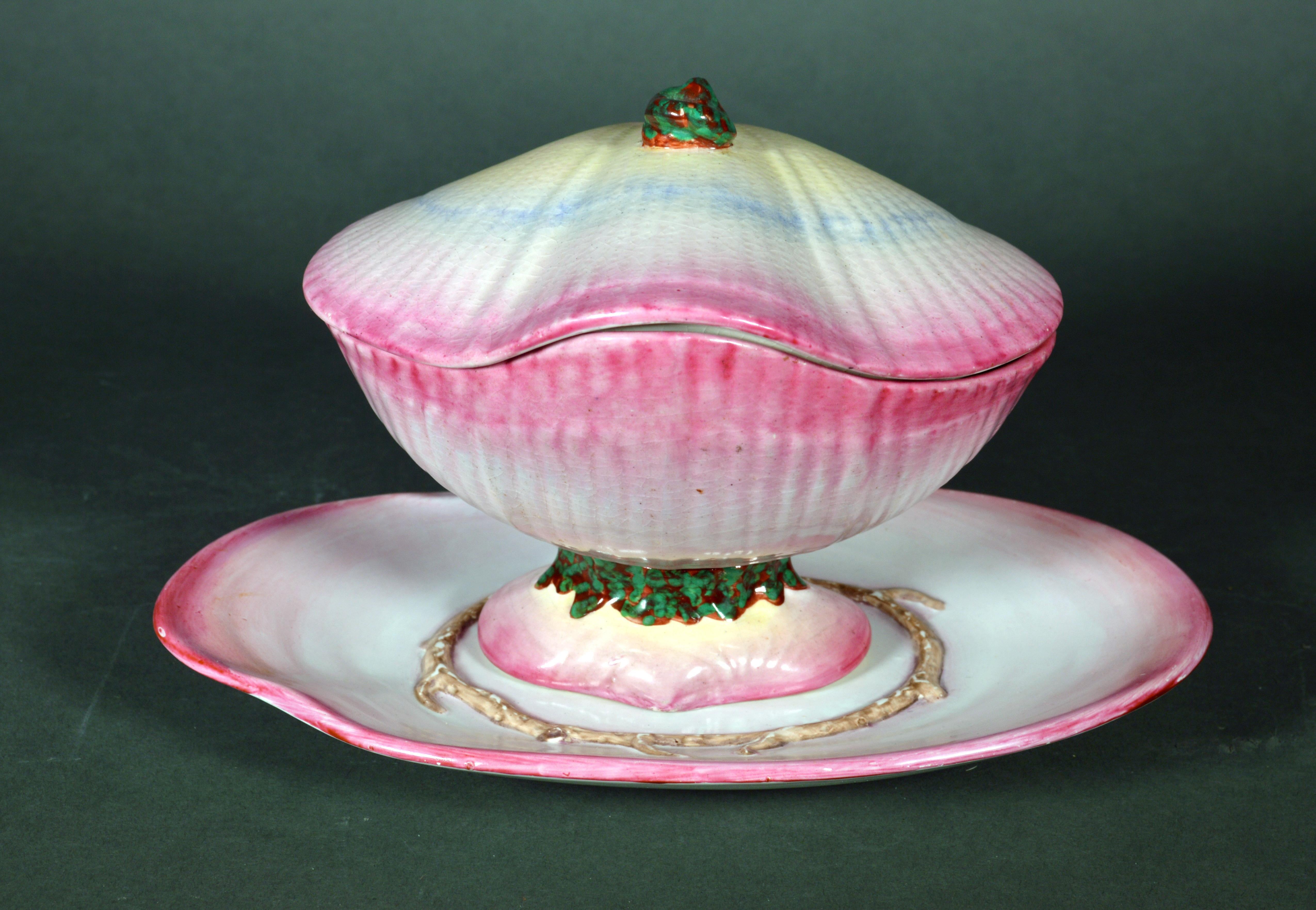Wedgwood Nautilus pearlware sauce tureen, cover and stand in the form of a Clam Shell,
circa 1810-1820
(NY9534-nrrr)

Dimensions: 5 3/4 inches high x 9 1/4 inches wide x 6 inches deep

Marks: Impressed WEDGWOOD & TXY, an O & a P.

Reference: