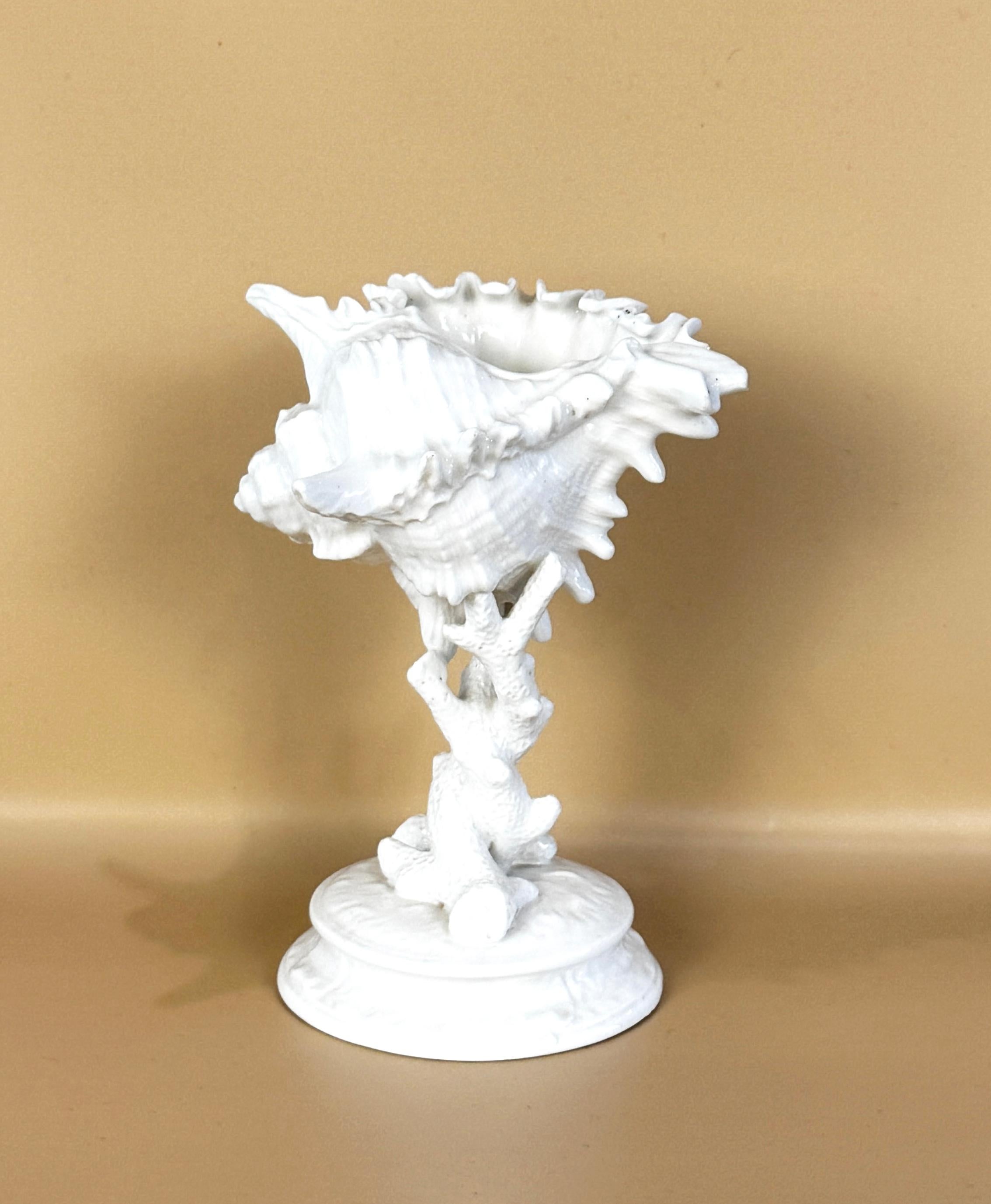 Wedgwood Porcelain Conch Shell & Coral Decorative Bowl or Table Sculpture, Late 19th Century, Marked to Base. Provenance: From the Rubin Collection. 

This sculptural piece is comprised of a naturalistic shell form bowl with wonderfully articulated