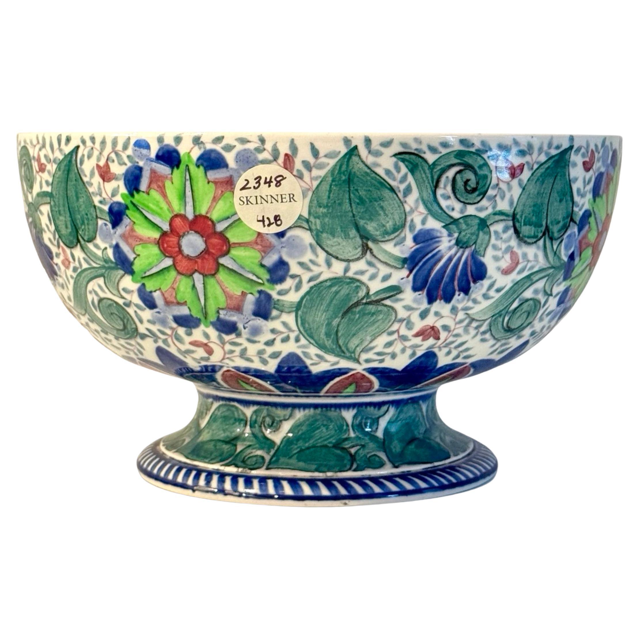 Wedgwood Queensware footed bowl from the Art Deco Period. Painted in greens and blues with a stylized foliate pattern, the base impressed Wedgwood, with painted pattern numbers, and Collection stickers. The perfect size for a decorative centerpiece,