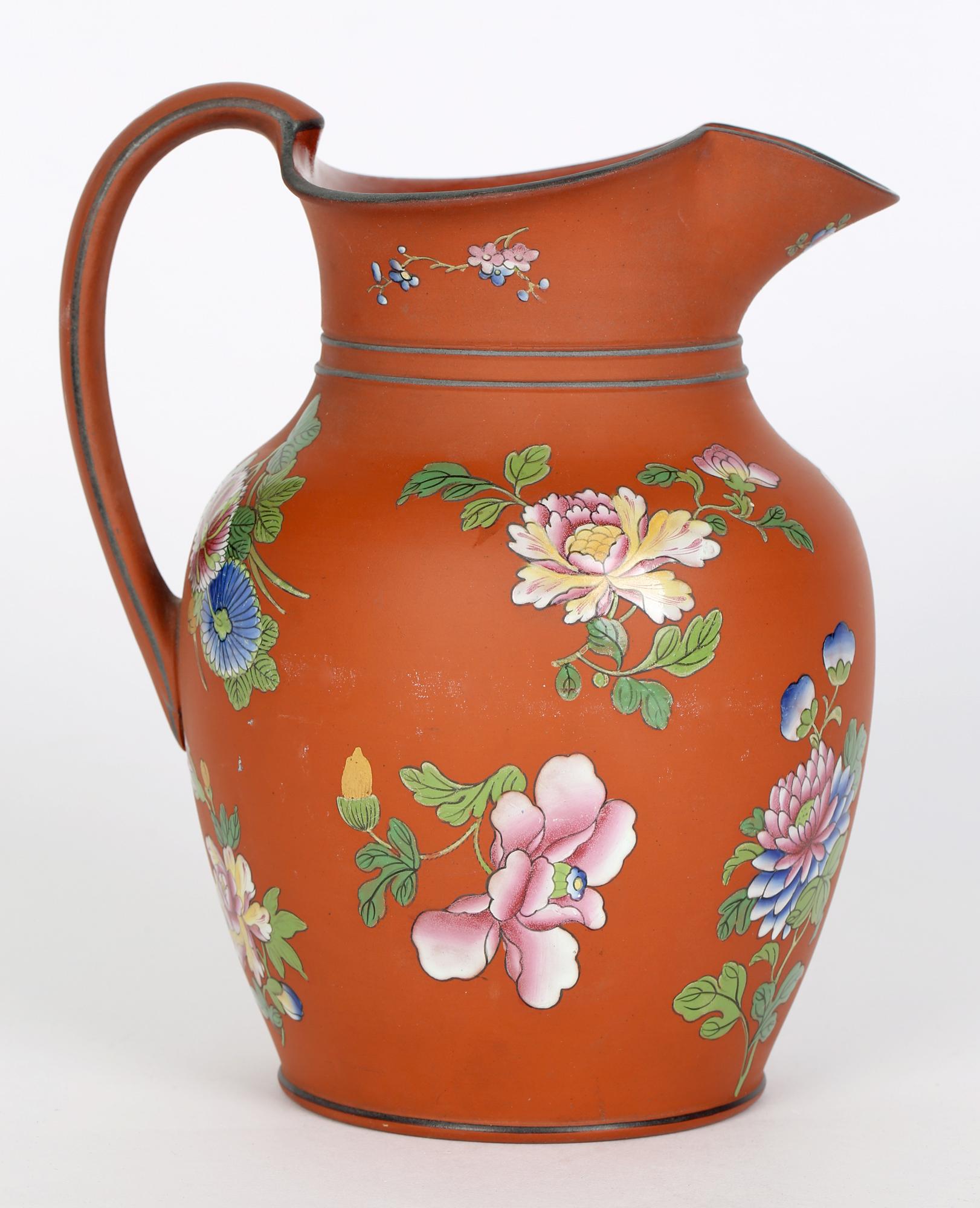 A fine Georgian English Terracotta Pottery Jug hand painted in the Rosso Antico style by Wedgwood and dating from the early 19th Century. The large jug is finely potted and is of rounded bulbous shape with a round foot rim and slightly recessed base