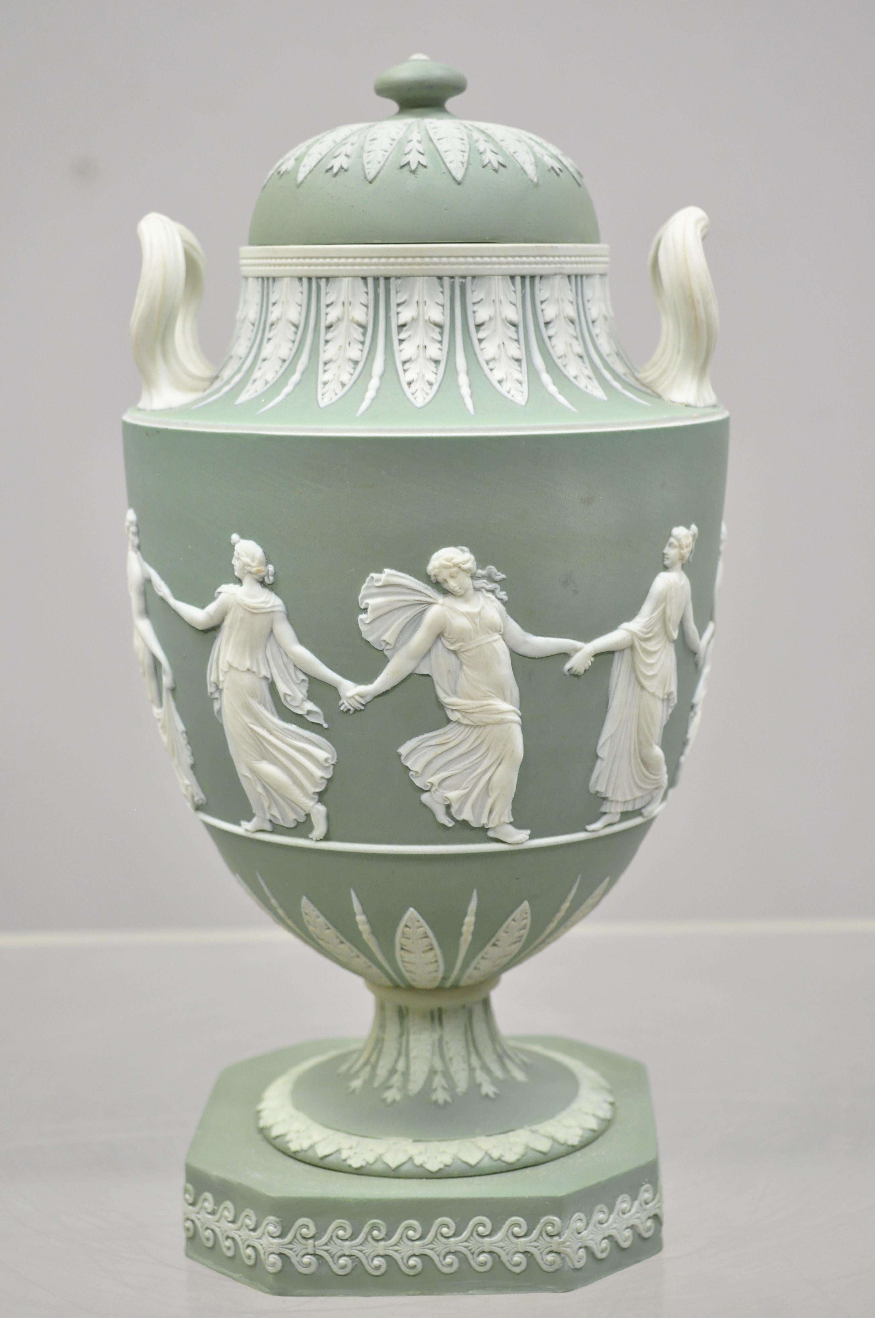 Wedgwood sage green lidded double handle urn vase with dancing figures, circa early 20th century. Measurements: 12.5