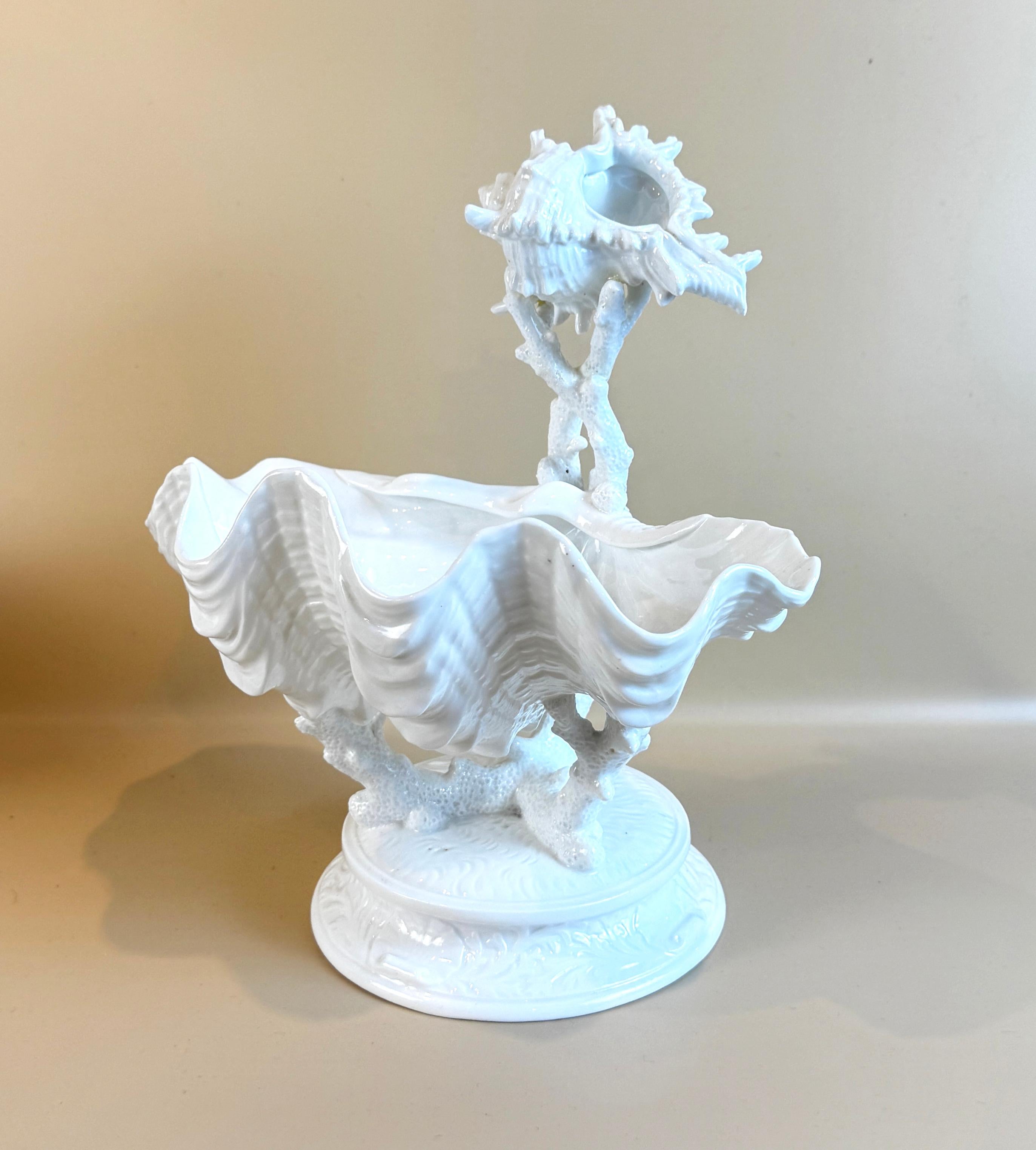 Wedgwood Bone China Two Tier Shell & Coral Centerpiece, Early 20th Century. This stunning two tier centerpieceis formed from a naturalistic conch shell gently raised on intertwined coral above a larger shell form bowl also supported on coral, Marked