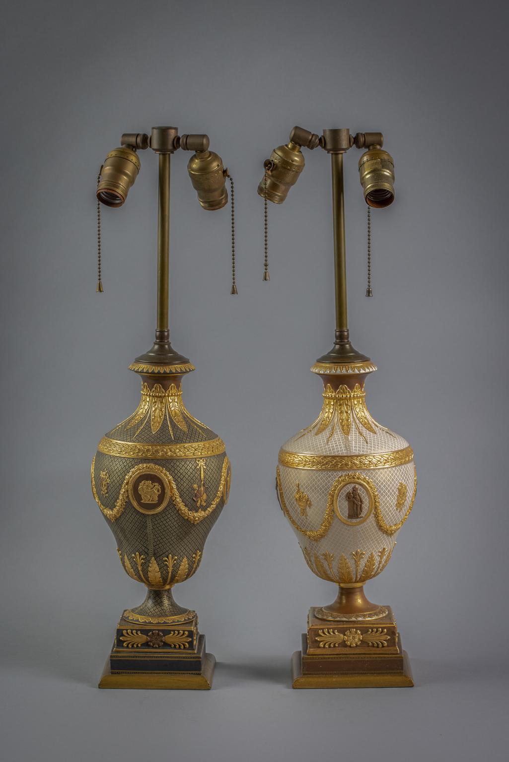 Mounted as a lamp, of ovoid form, decorated with oval medallions depicting classical figures on a gilt decorated cream ground, hung with floral garland continuing to a flared neck and removable lid, raised on a socle and ending on a square base.