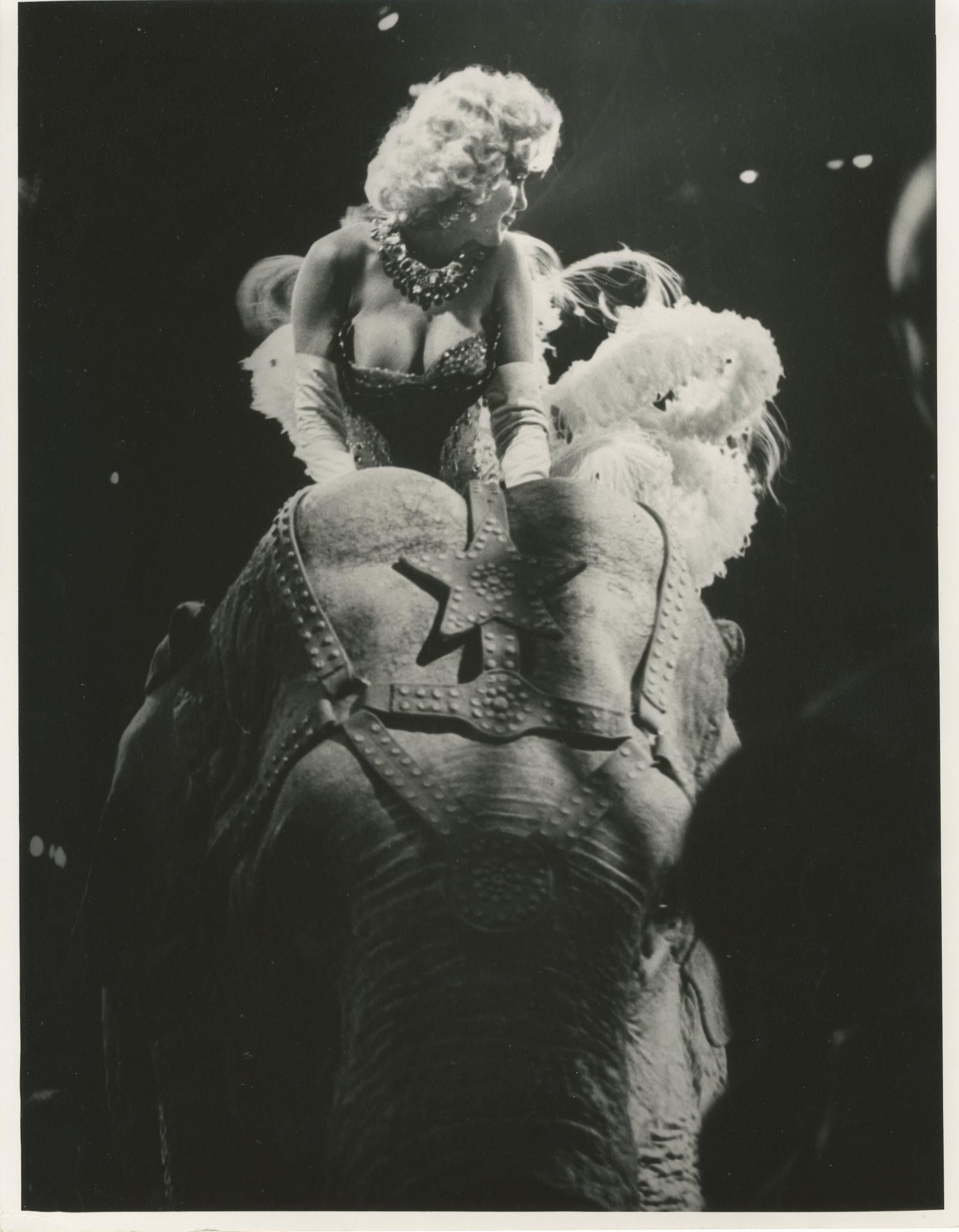 Weegee Black and White Photograph - Marilyn Monroe Riding the Elephant