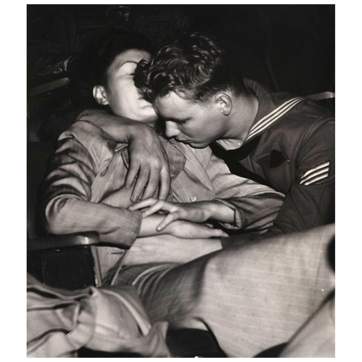 sailor kissing girl