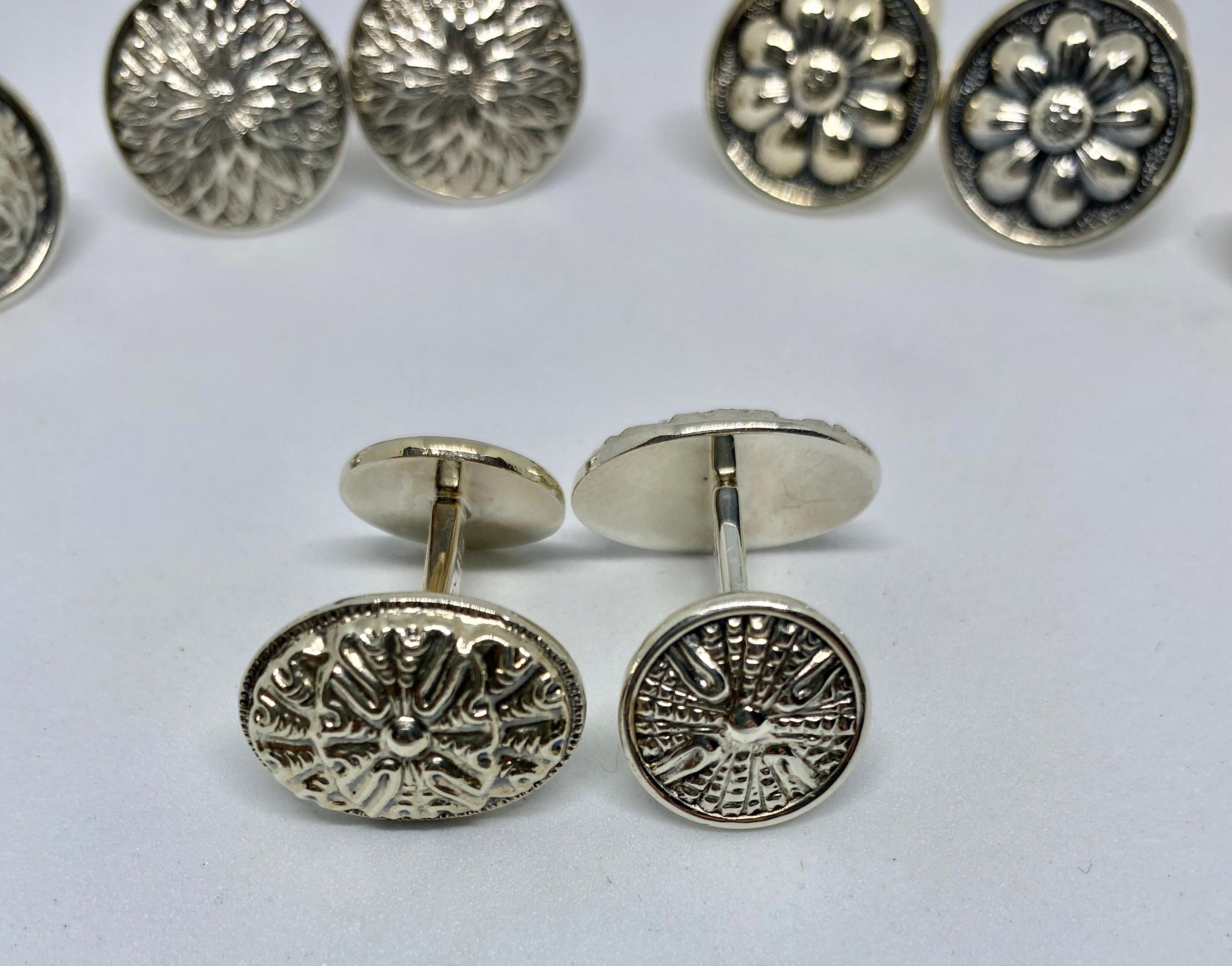 Five pairs of double-sided cufflinks in sterling silver by Gianmaria Buccellati.

Each pair has a face that's approximately 18mm in diameter and a back that's approximately 13mm in diameter. One of the five pairs has oval-shaped faces of roughly the