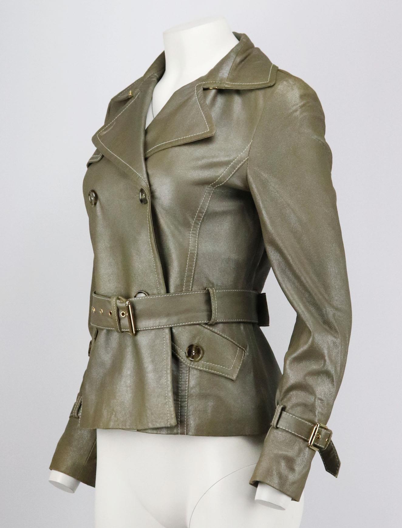 This vintage jacket by Weekend Max Mara is made from metallic leather, it's cut for a slim silhouette with belt around the waist. Metallic leather. Button fastening at front. 100% Leather; lining: 100% polyester. Size: IT 42 (UK 10, US 6, FR 38).