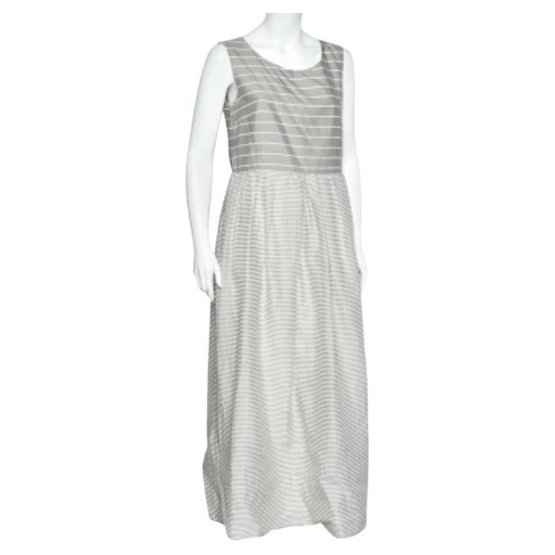 Stay comfortable and stylish all day with this maxi dress from Weekend Max Mara. It has been styled using grey cotton and silk fabric, which is highlighted by striped detailing. This maxi dress has been provided with a zip-type closure.