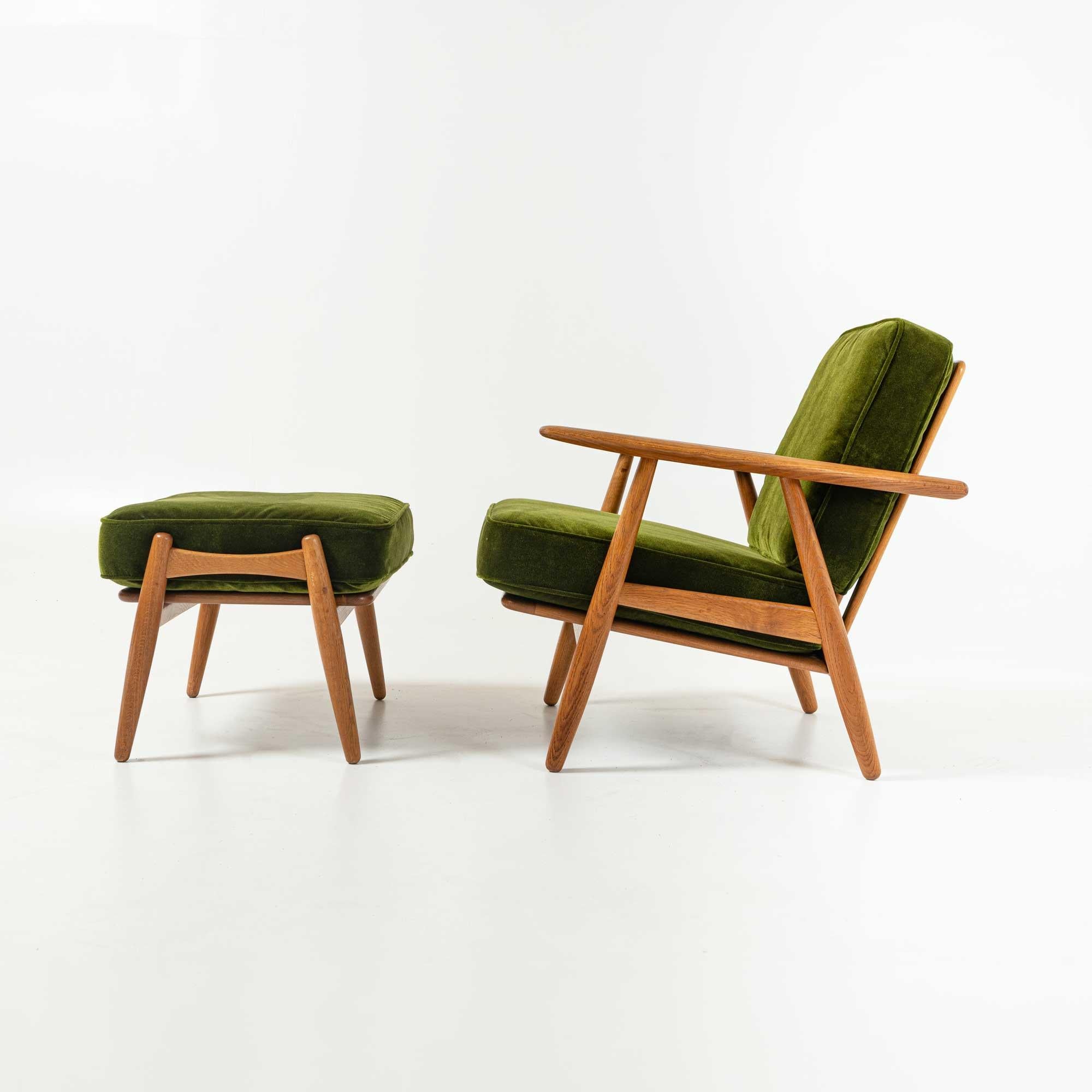 A complete set of GE-240 lounge chair and ottoman, Designed by Hans J. Wegner, Produced by GETAMA, Denmark, 1960s, in Oak. Cushions have recently been reupholstered in HBF Martini Green Velvet Fabric. In overall great condition.