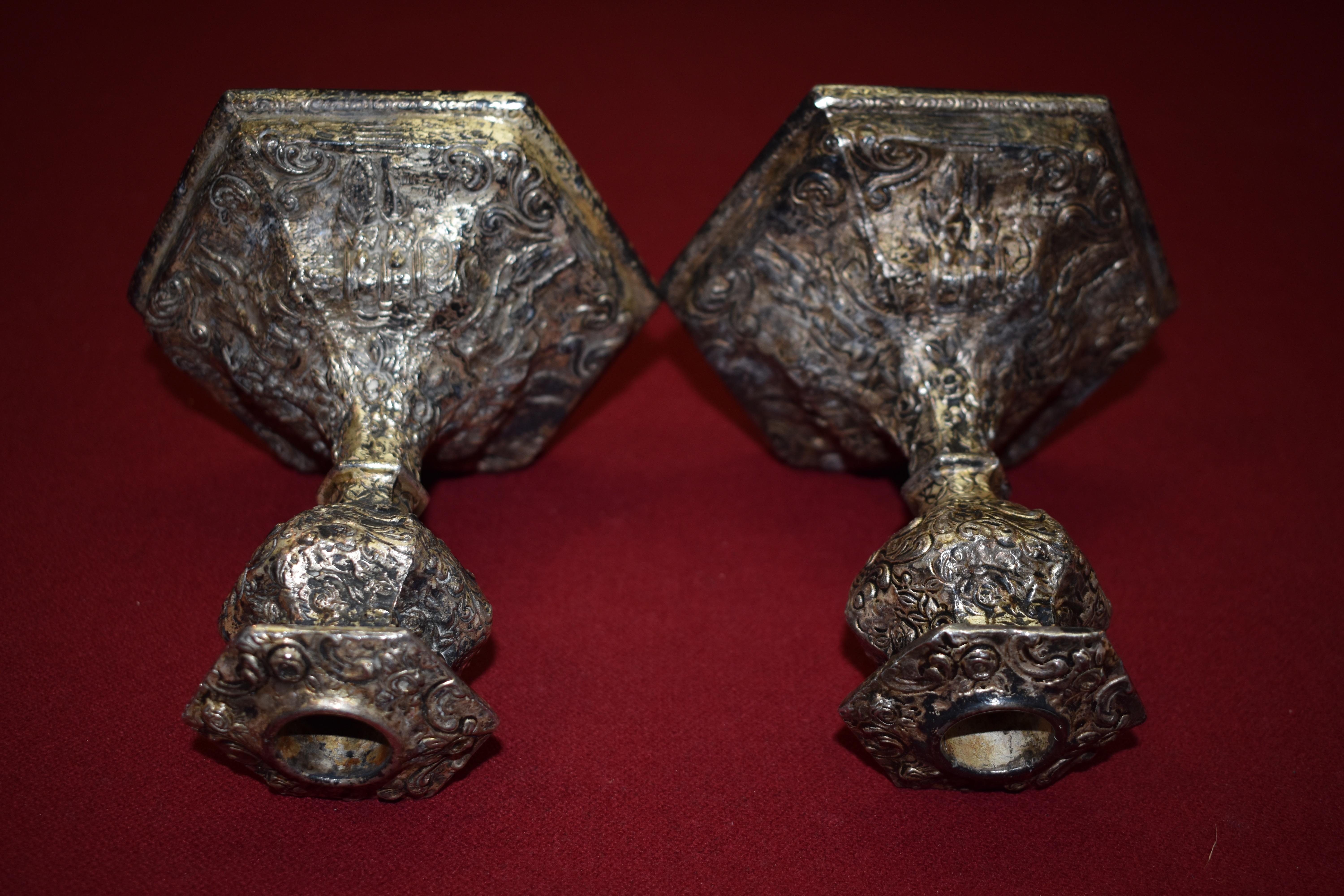Weidlich Bros. Silver plate candle holders circa 1922 Bridgeport, CT. #2343. Very good condition and excellent patina. The candlesticks are very ornately detailed with a man and a woman couple and a variety of florals. Base is 5