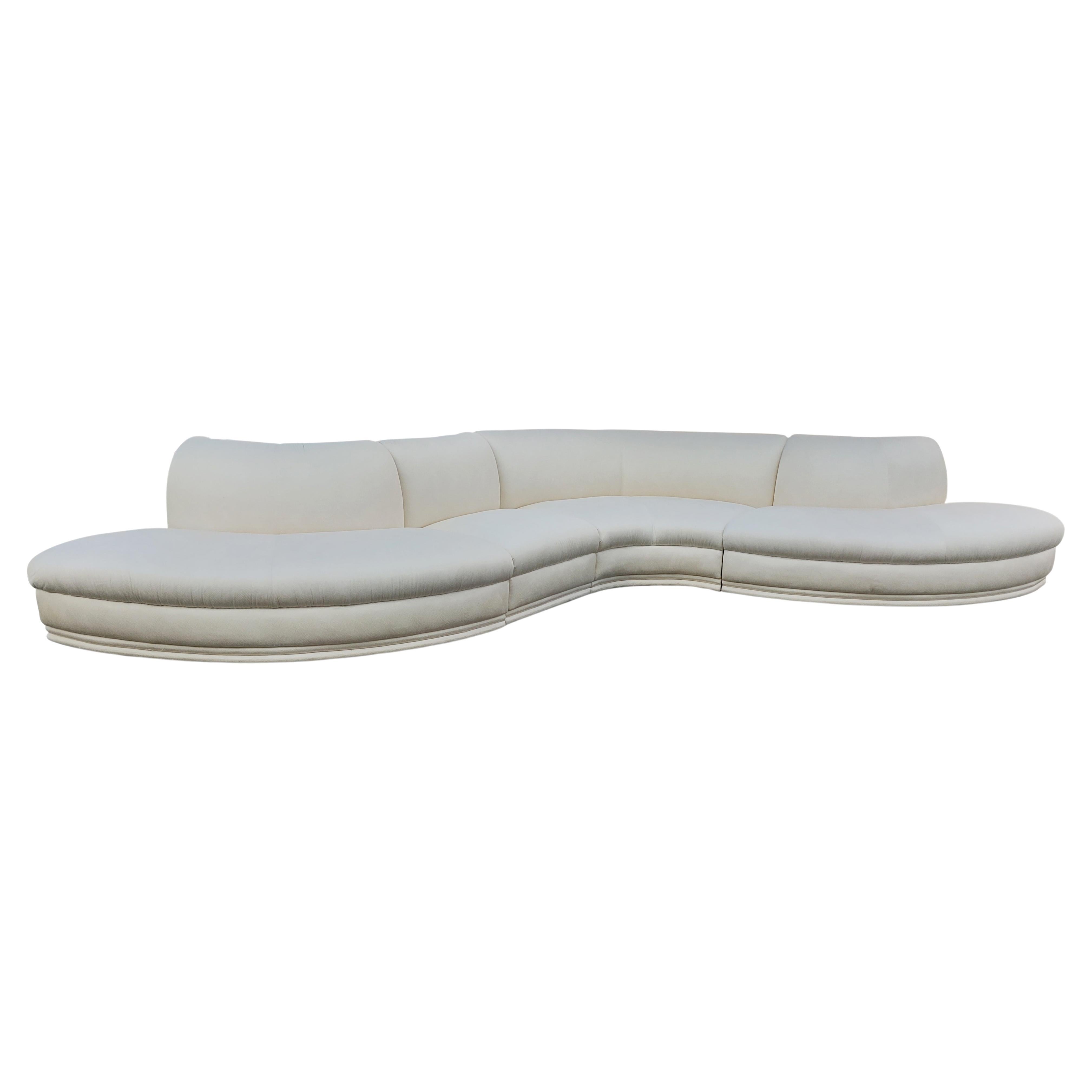 A stunning and sculptural sofa produced by Weiman Furniture Company from the 1980s and is super comfortable. It features a four-piece design with low profile feet. This sofa is in its original white upholstry with an alternating shell-like pattern.