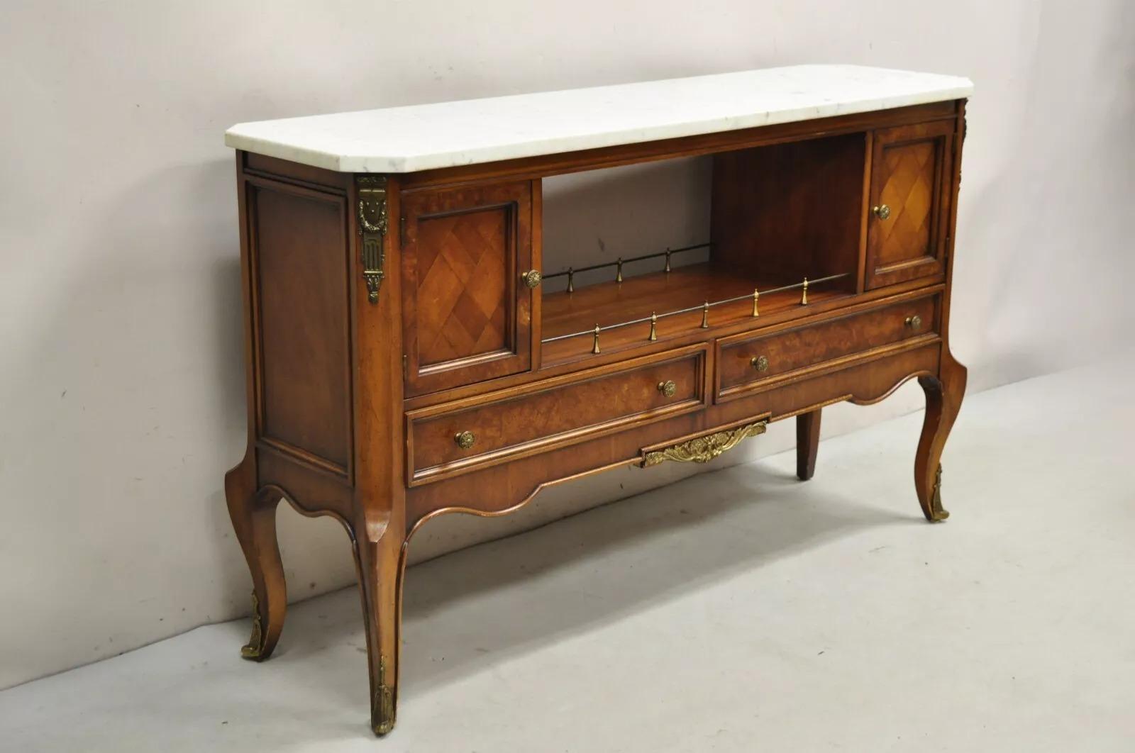 Vintage Weiman French Louis XV Style Marble Top Fruitwood Server Cabinet Console Table with Ornate Brass Oromolu. Item features 2 drawers, white Italian marble top, and original label. Circa Mid 20th Century. Measurements: 30.25