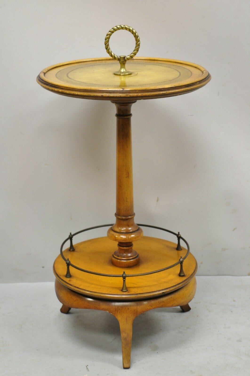 Weiman Heirloom small leather top round smoking Stand side table with brass ring. Item features a tooled leather top, brass ring handle, nice small size, original stamp, very nice vintage item, quality American craftsmanship. Circa Mid 20th Century.