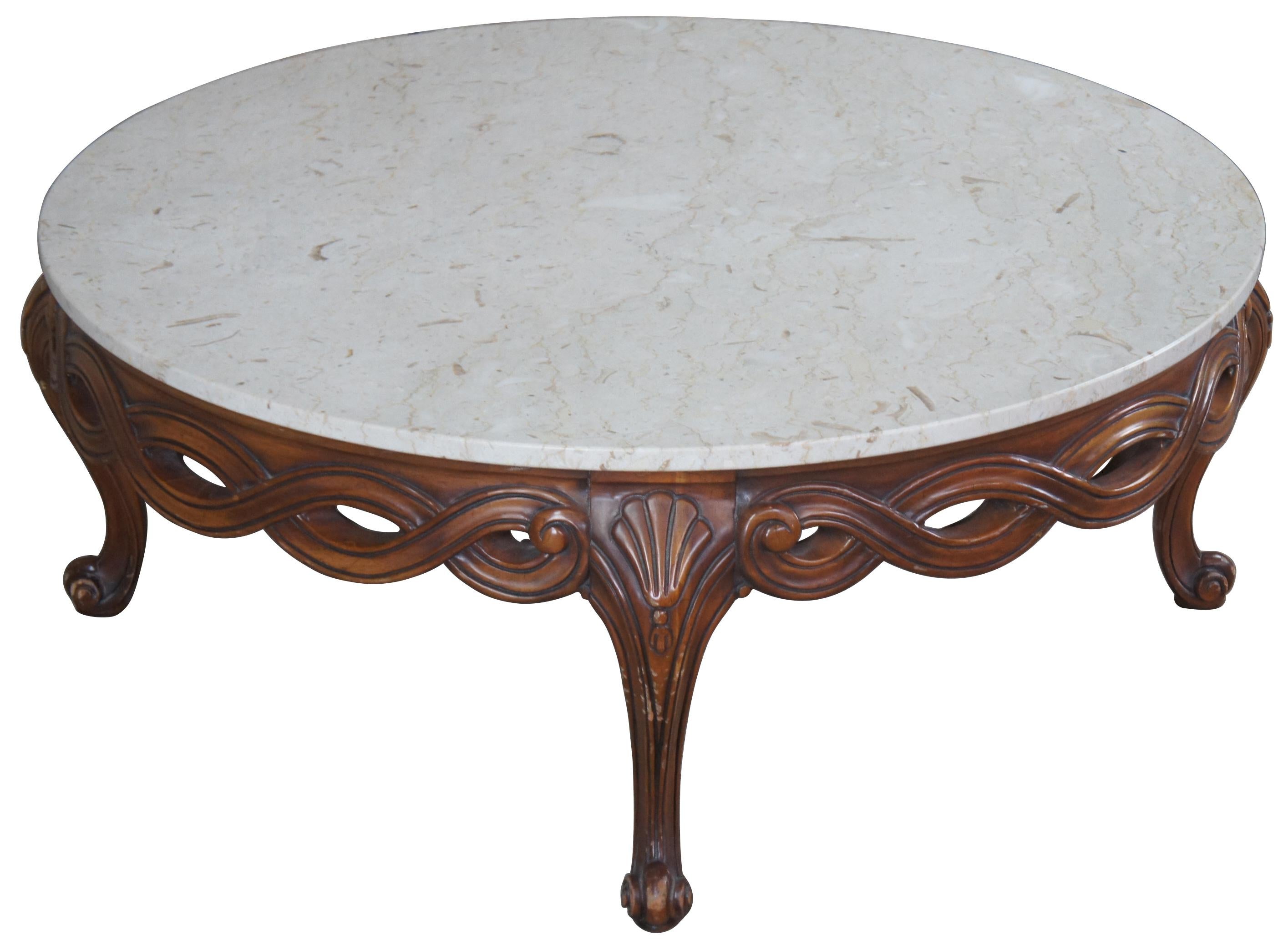 Weiman French Provincial coffee table, circa 1960s. Features a walnut pierced and braided base with cabriole legs leading to scrolled foot. Includes scalloped carvings and an Italian marble top.
 