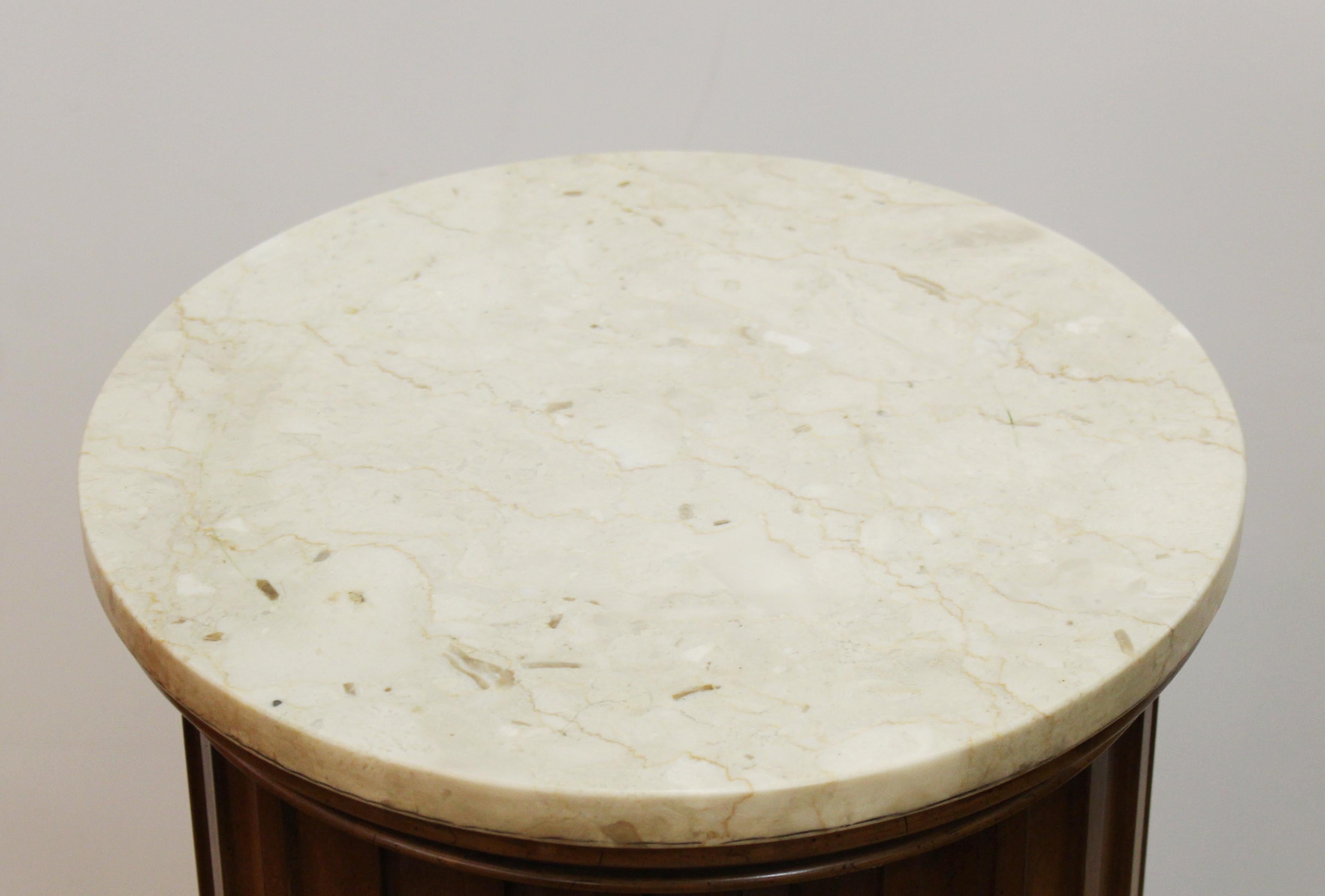 Weiman fluted neoclassical style pedestal in carved wood with a round carved marble top. Made in the United States during the mid-20th century, in excellent vintage condition.