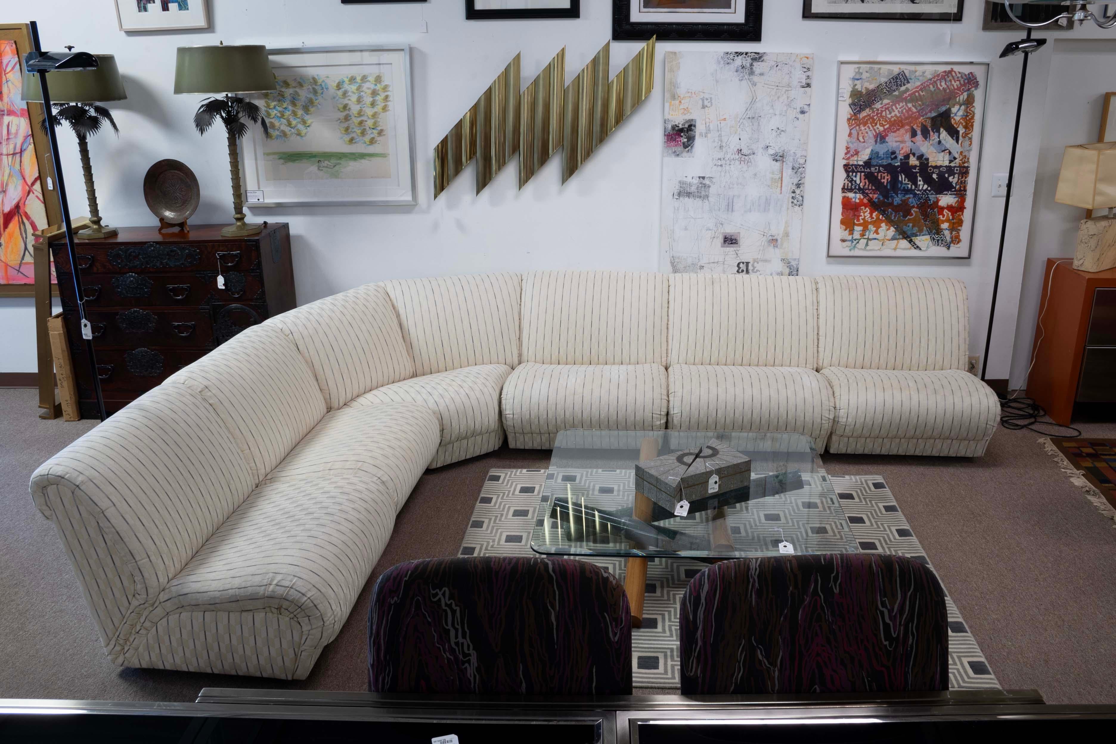 Luxurious and meticulously crafted, the Weiman Preview Attributed 6 Piece Modular Sectional Sofa embodies Mid-Century Modern elegance at its best. This stunning sectional features an upholstery in a neutral tone, offering supreme comfort and stylish