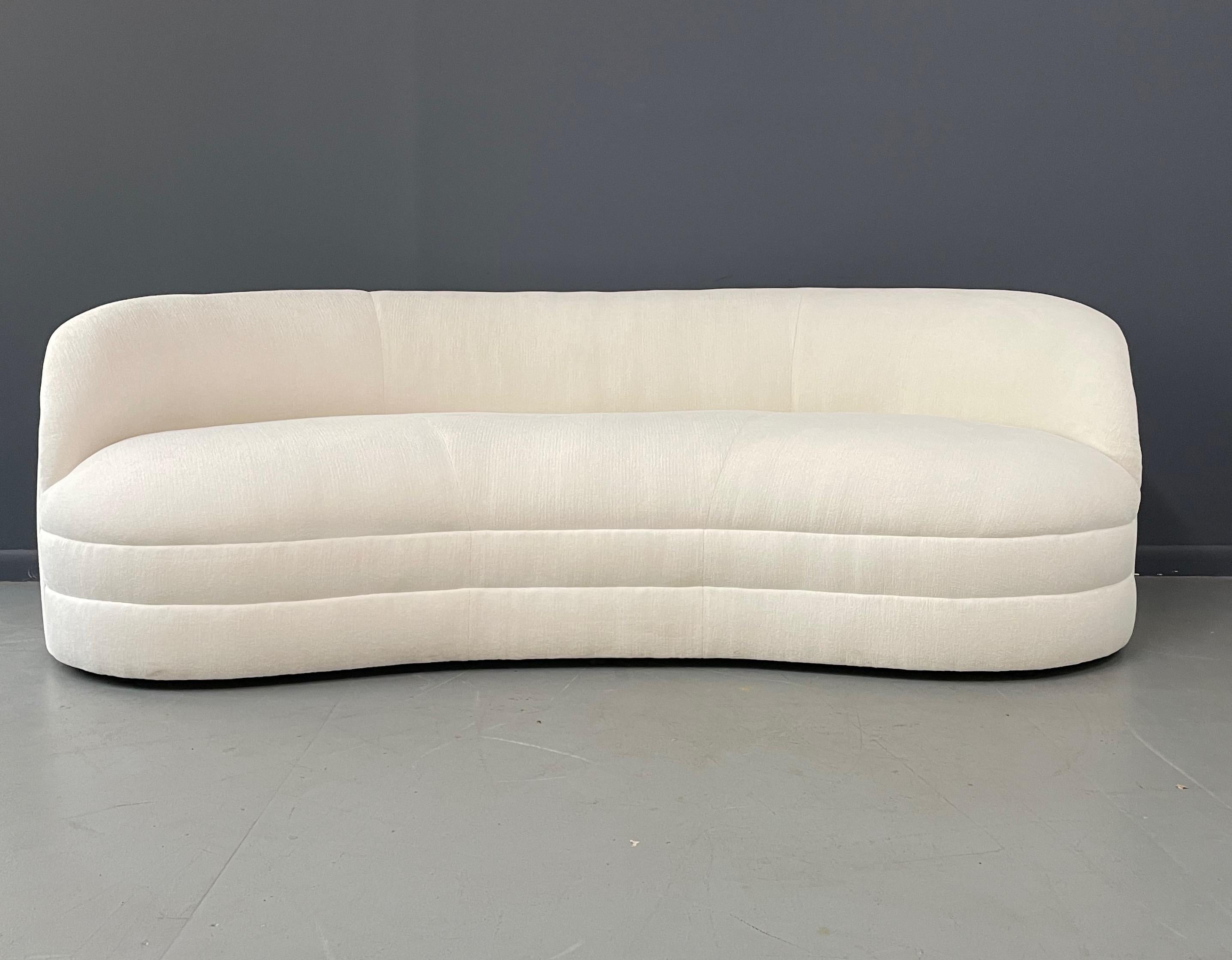This lovely gently curved sofa has just been stripped down to the frame and is awaiting new upholstery. After purchase we will upholster this sofa in this lovely white textured fabric. The work will take approximately three weeks and you will have a