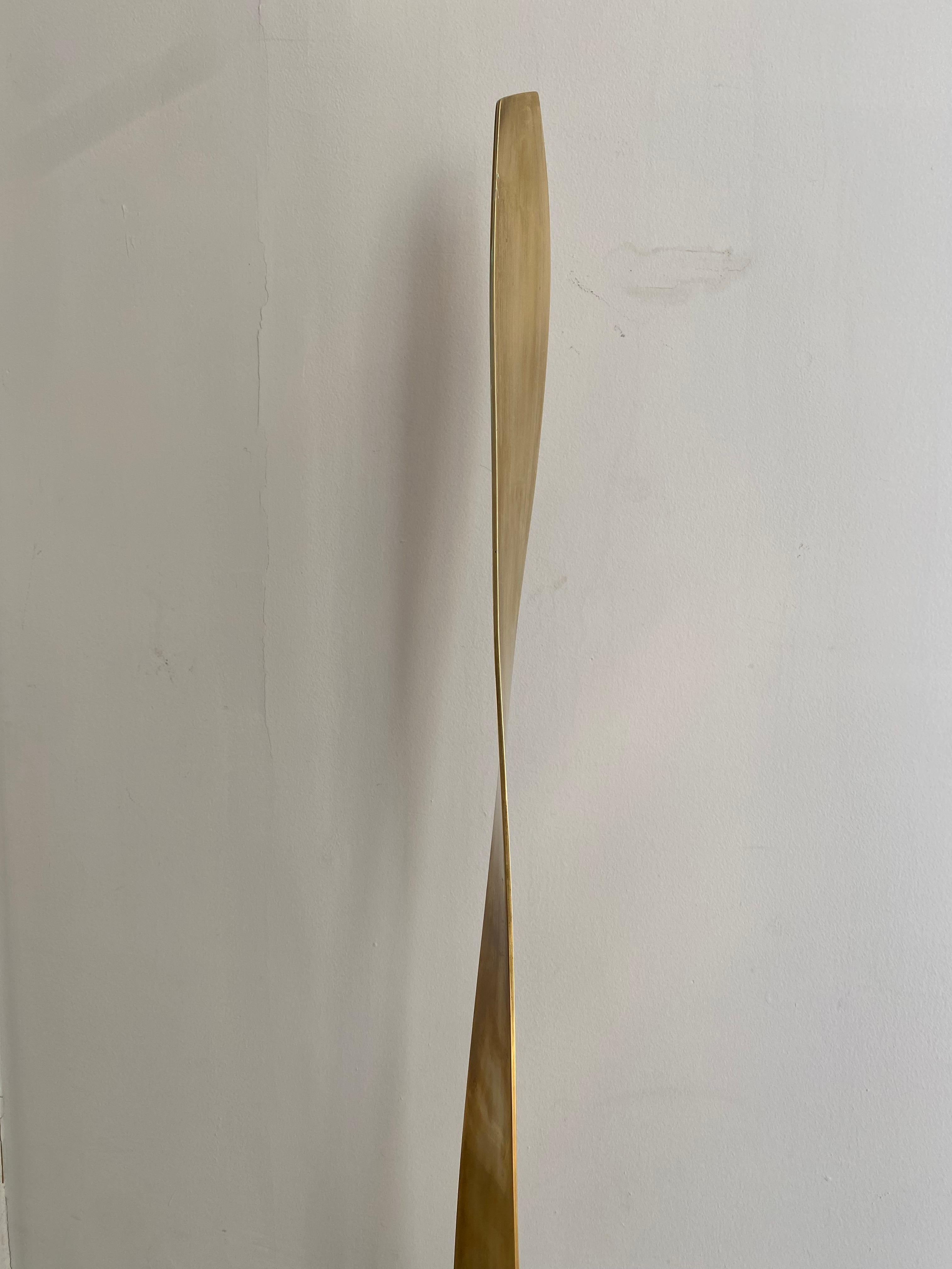 Abstract motion sculpture by Weinberg (Frederick?) of twisted ribbon of brass tapering above marble base.  Signed 