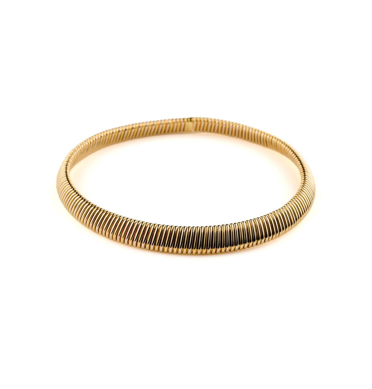 Timeless Tubogas Necklace made by the famous Weingrill circa 1970's, showcasing 18k yellow and white gold in a perfectly balanced necklace. The smooth dimensions and weight make this jewel suitable for everyday and special occasions,  indispensable