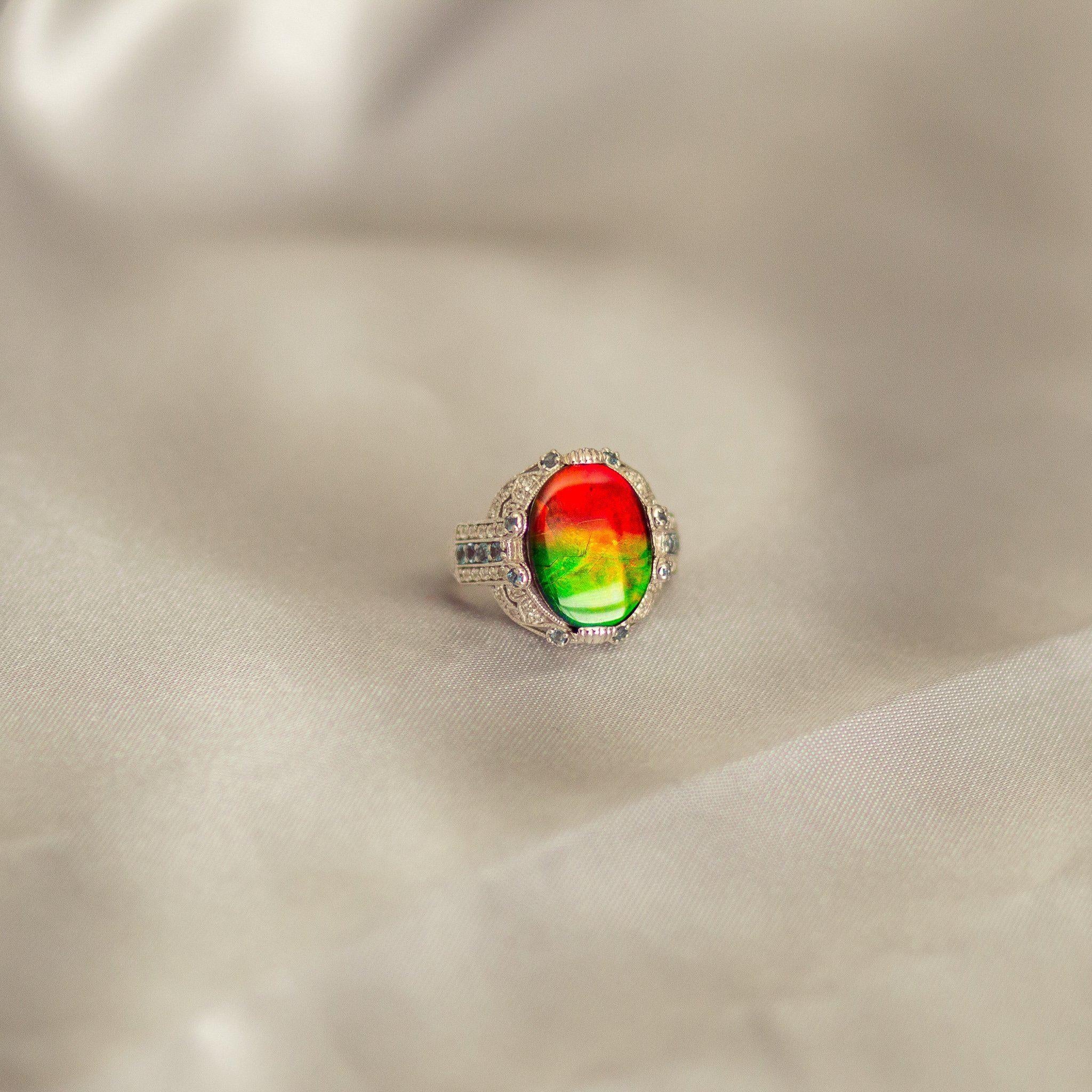 Bob Weinman designed, A grade 16mm x 12mm oval Ammolite set in sterling silver accented with 0.42TC alexandrite and 40 diamond cut white zircon.

Since 1979, KORITE has been the home of superior Ammolite, inspiring the world with the rarity and