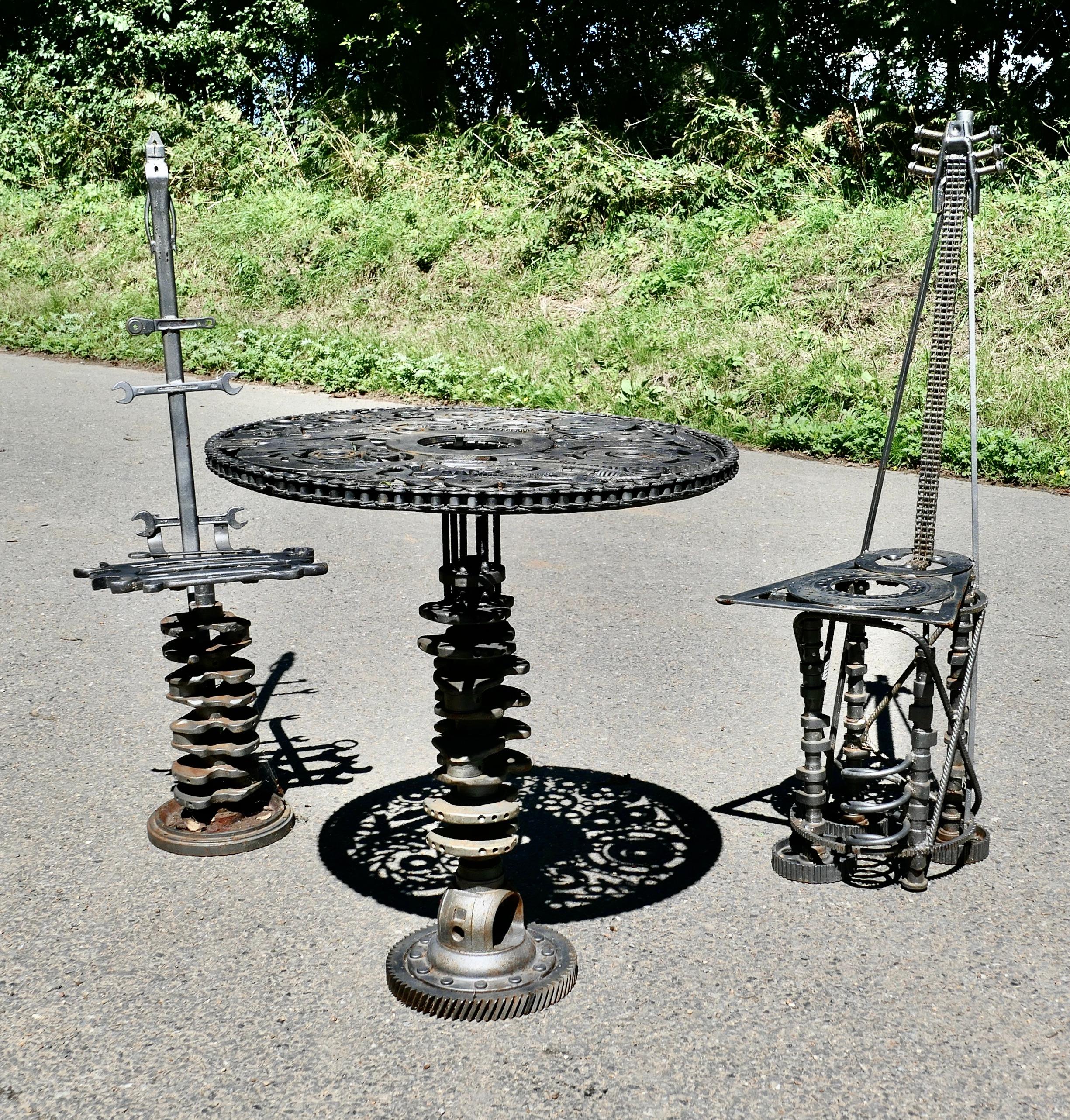 Weird and Quirky Bistro Garden Table and Chairs  

Weird and Quirky Bistro Garden Table and Chairs made from Iron Tools and Car parts
This is no doubt a “Work of Art” with a mechanical theme, the table and chairs are made from every imaginable