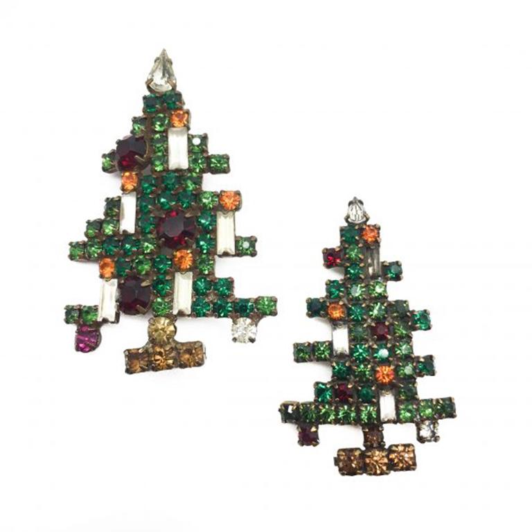 A fun figural 1950s Vintage Weiss Christmas Tree brooch. This tree is the five candle version. We also have a three candle version available. This lovely tree is packed with green, red, white and amber rhinestones surrounding the five candles. The
